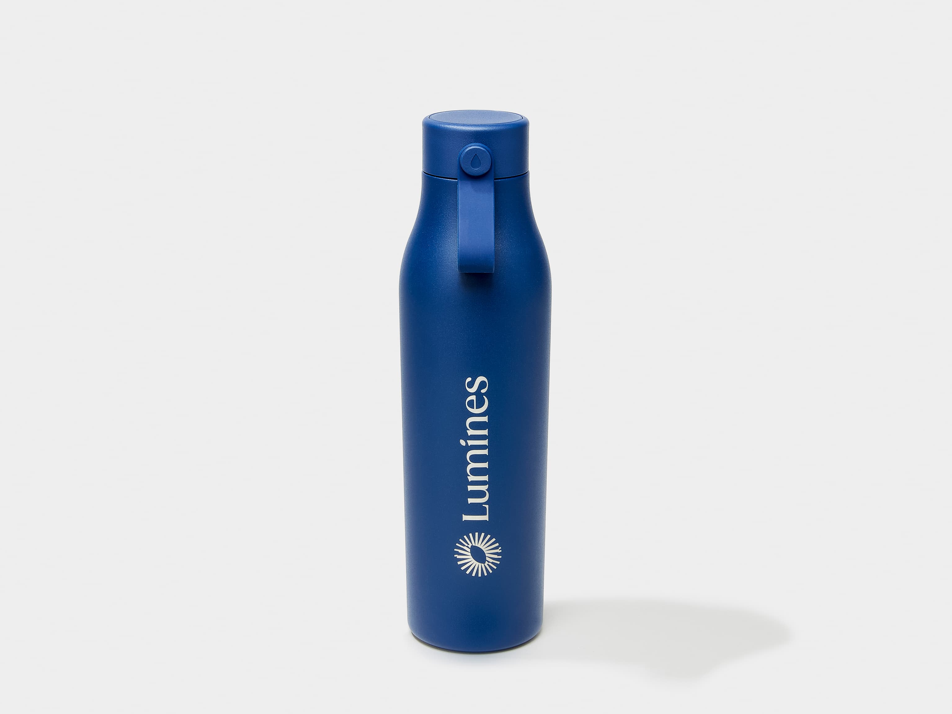 A midnight blue MOO water bottle with custom engraving.