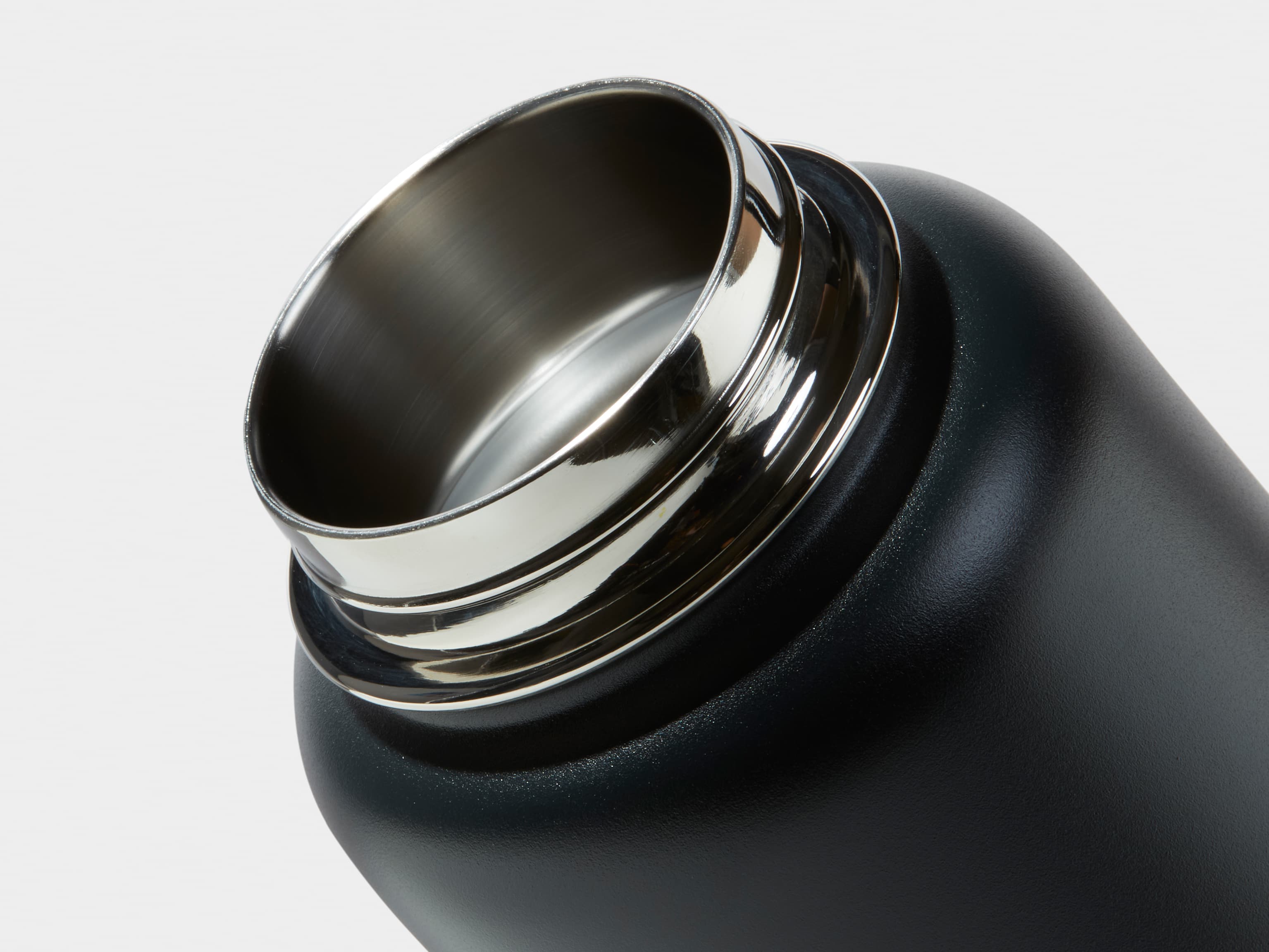 Close up shot of the bottle lip on the Large Insulated Water Bottle in Jet Black