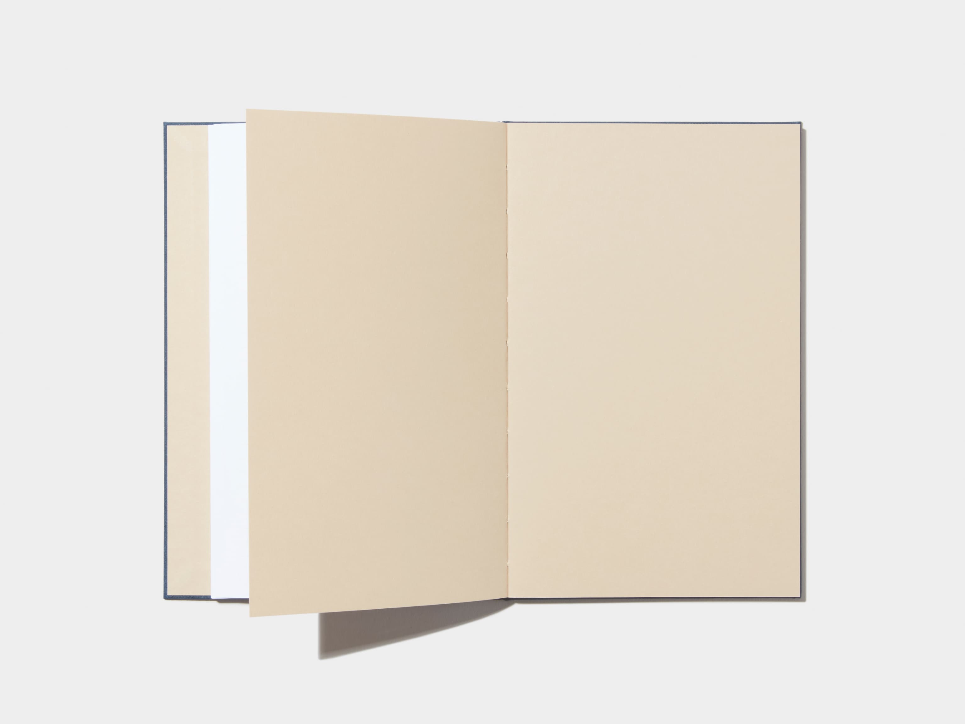 An opened Midnight Blue Hardcover Notebook with empty pages 