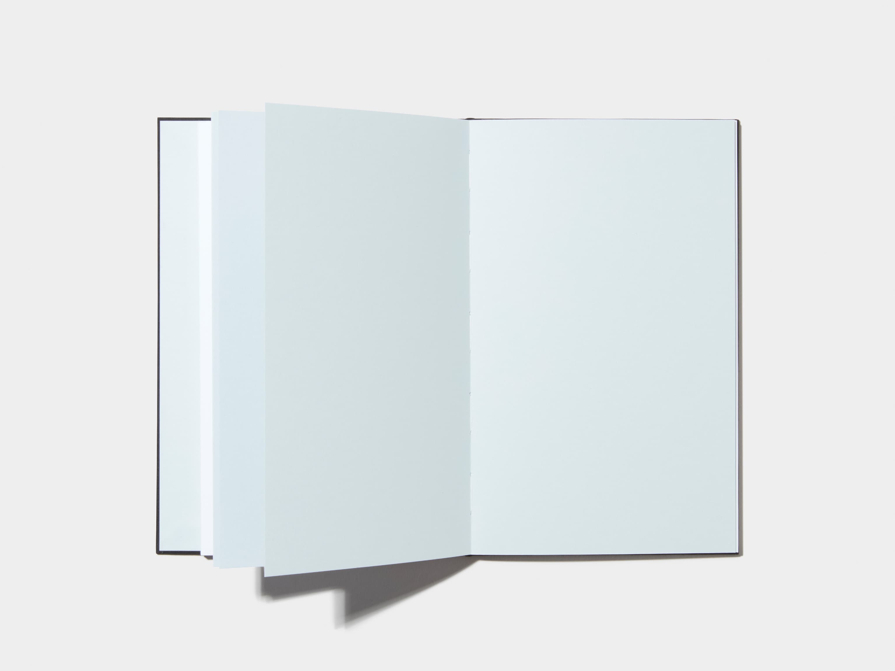 An opened Jet Black Hardcover Notebook with empty pages 