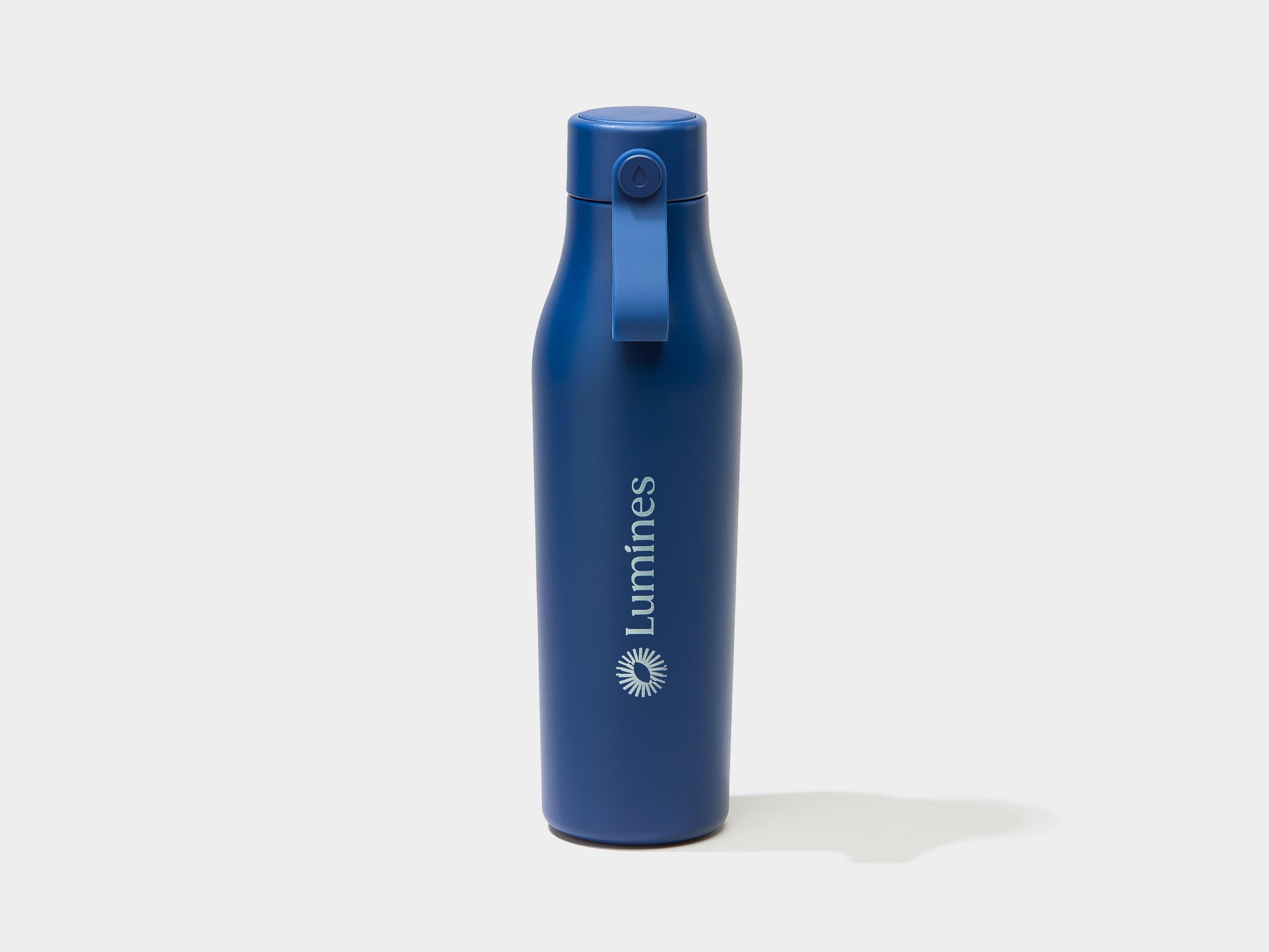 A blue water bottle with silver custom branding.