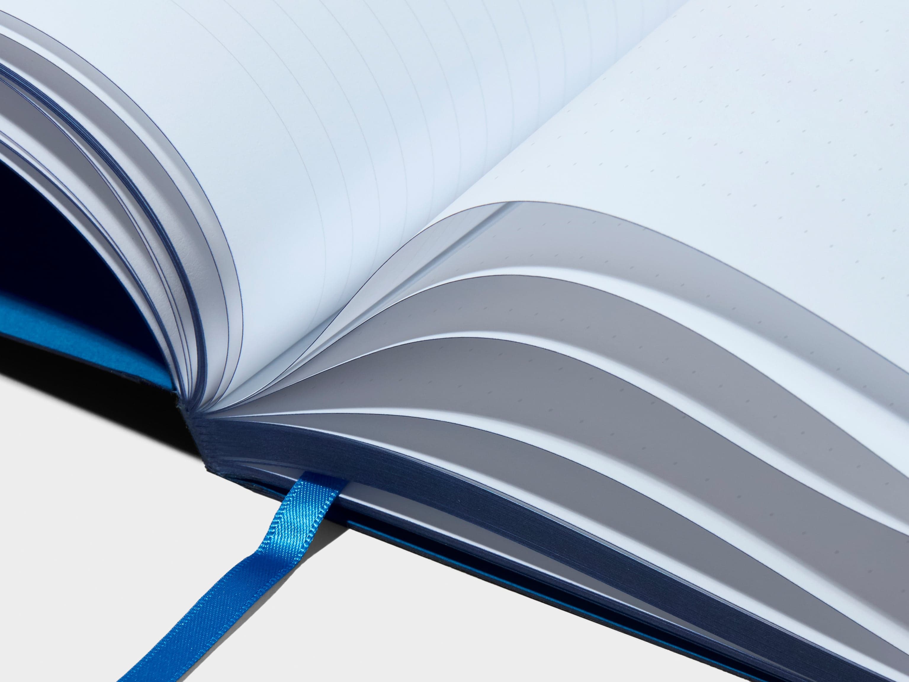 Detail image of the pages and spine of a blue planner.