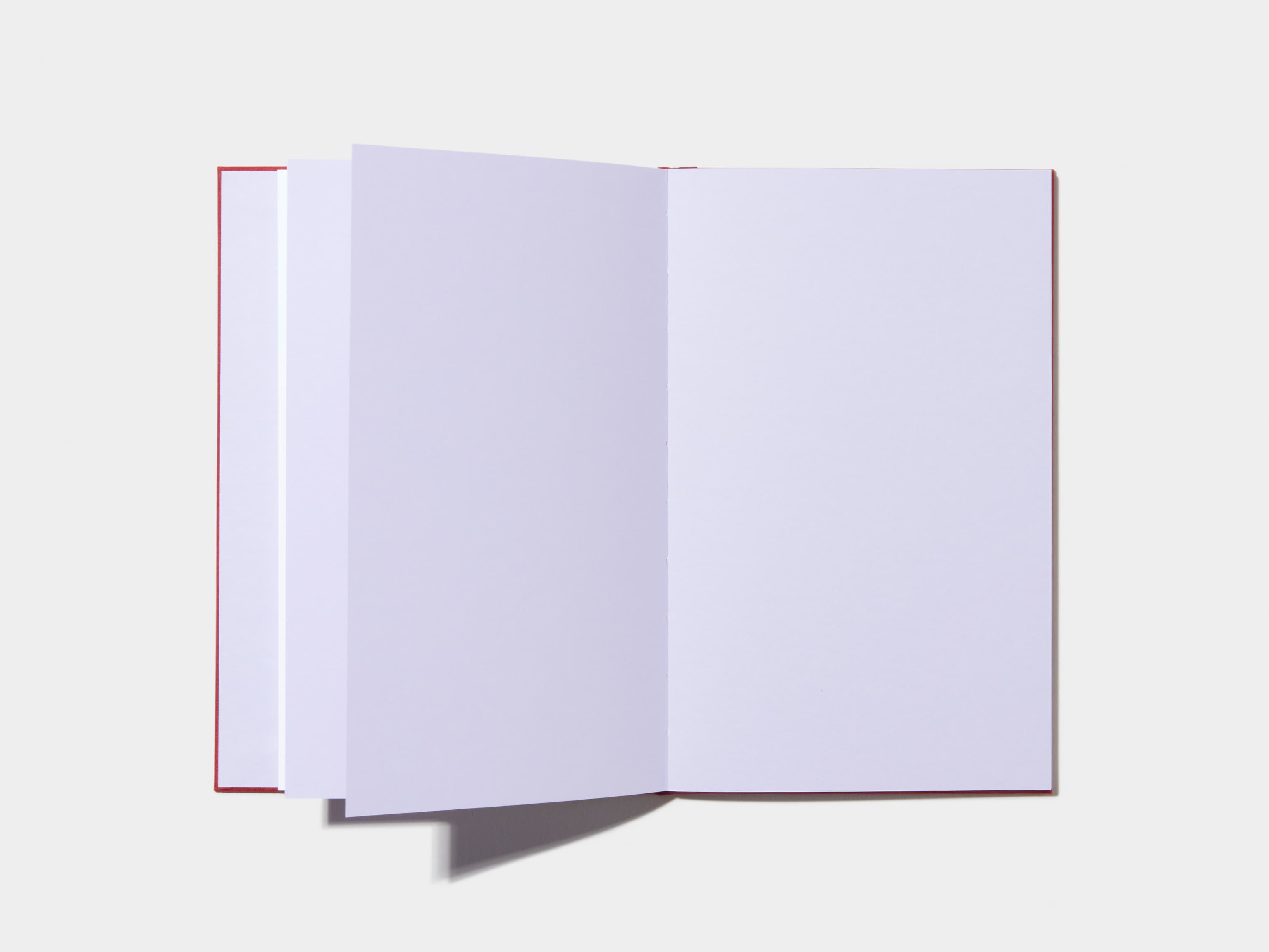 An opened Wine Red Hardcover Notebook with empty pages 