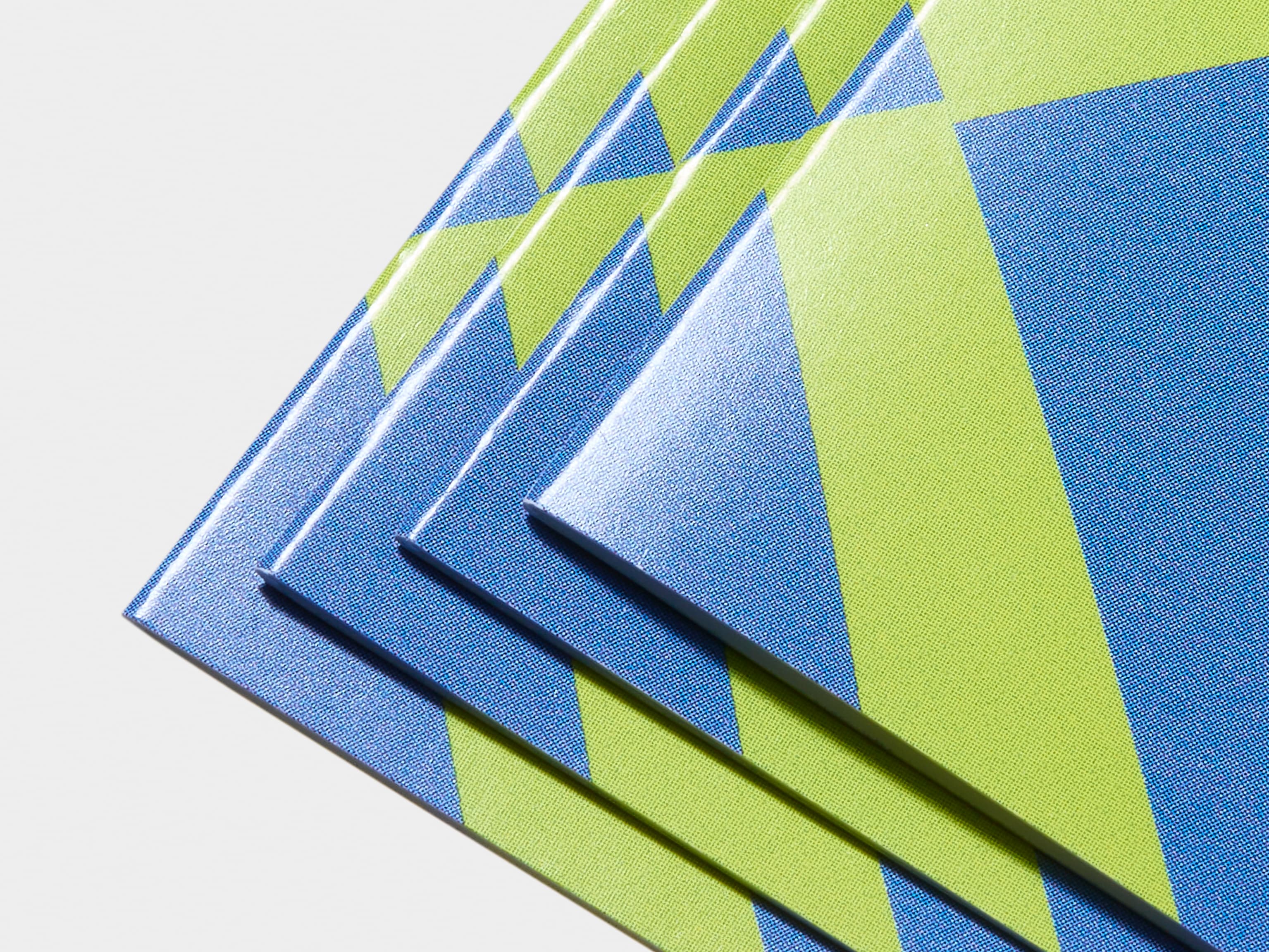 A detail image of the corner of a gloss bi-fold brochure.