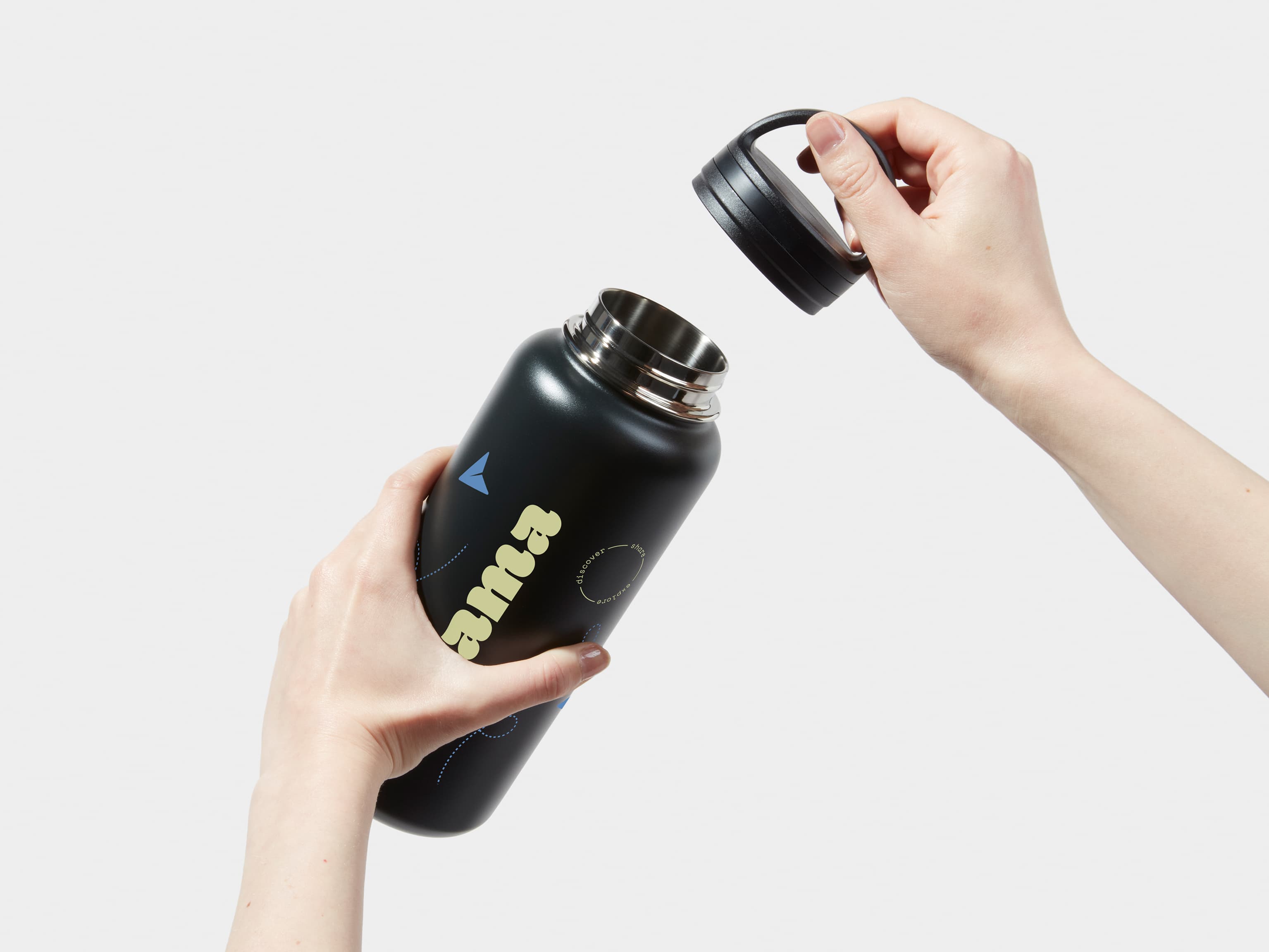 Two hands taking off the lid of a Large Insulated Water Bottle in Jet Black with 360 wrap printing customisation