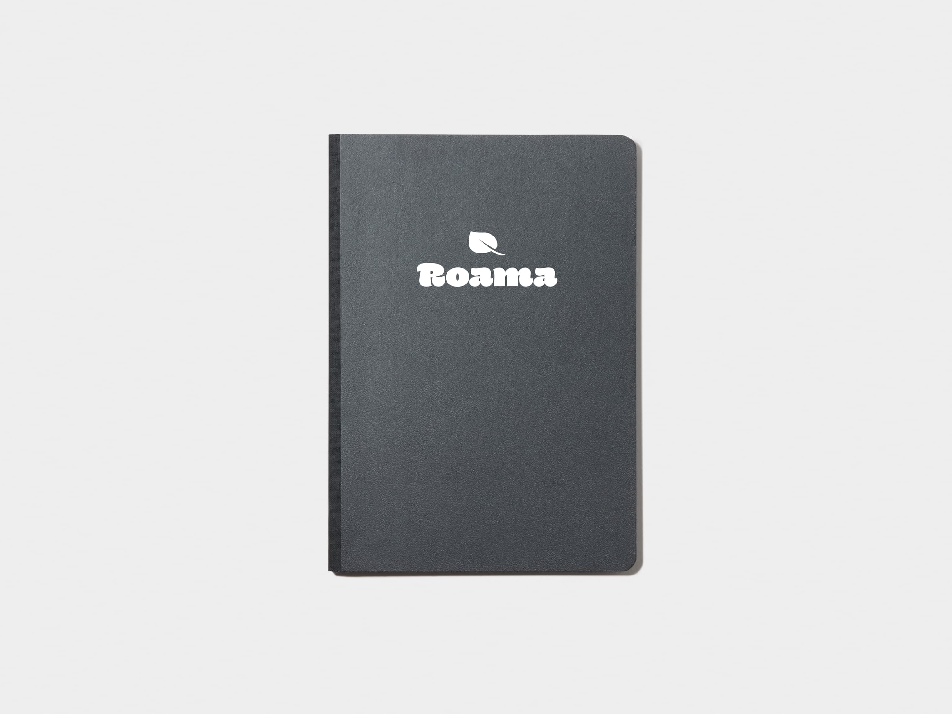 A jet black softcover notebook with white foil customisation.