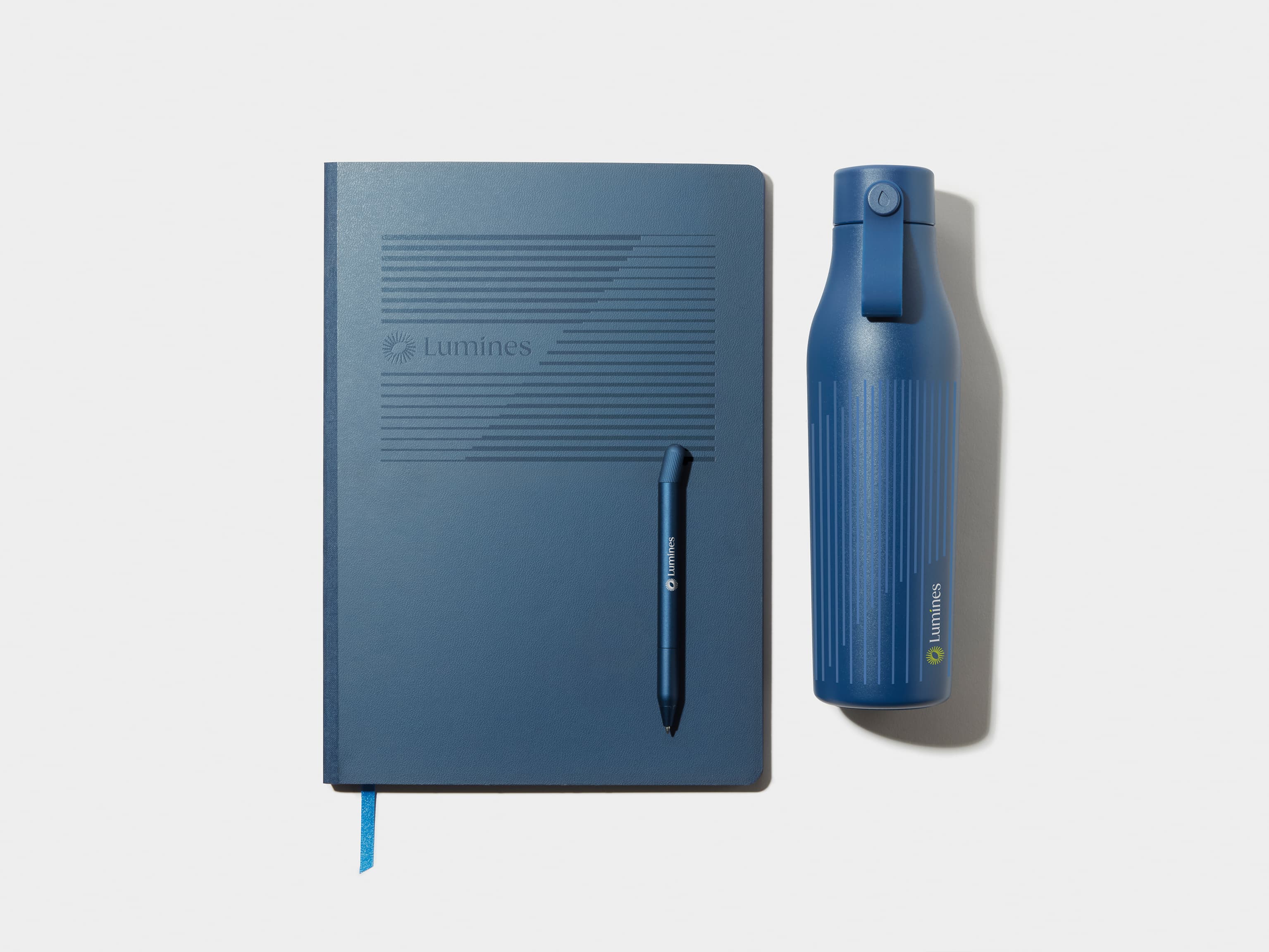 Large Midnight Blue MOO Softcover Notebook with Blind Deboss finish alongside the MOO Twist Pen and Water Bottle