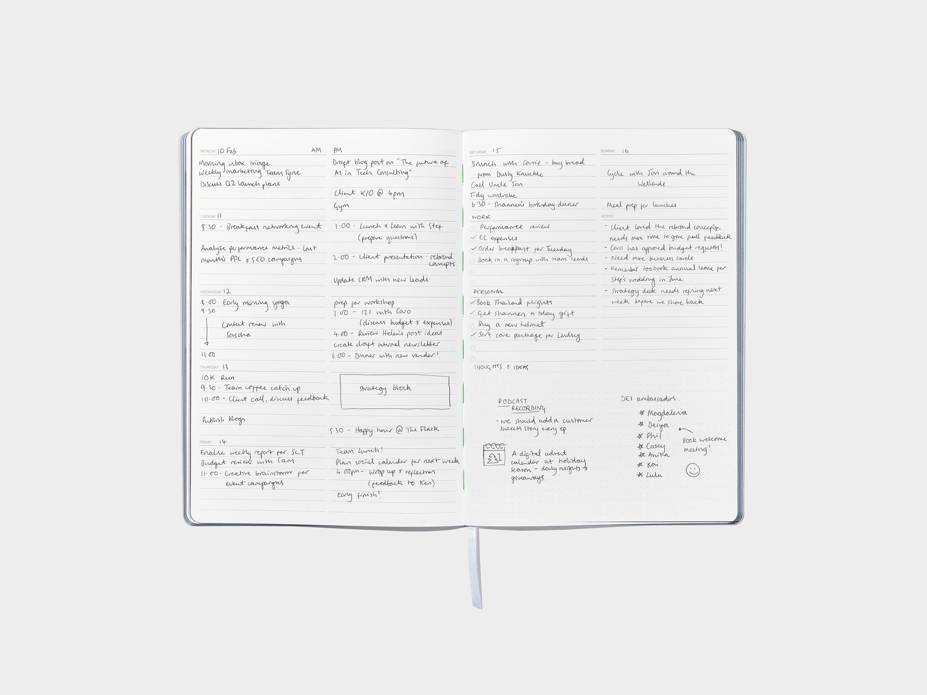 A open softcover planner with writing in it.