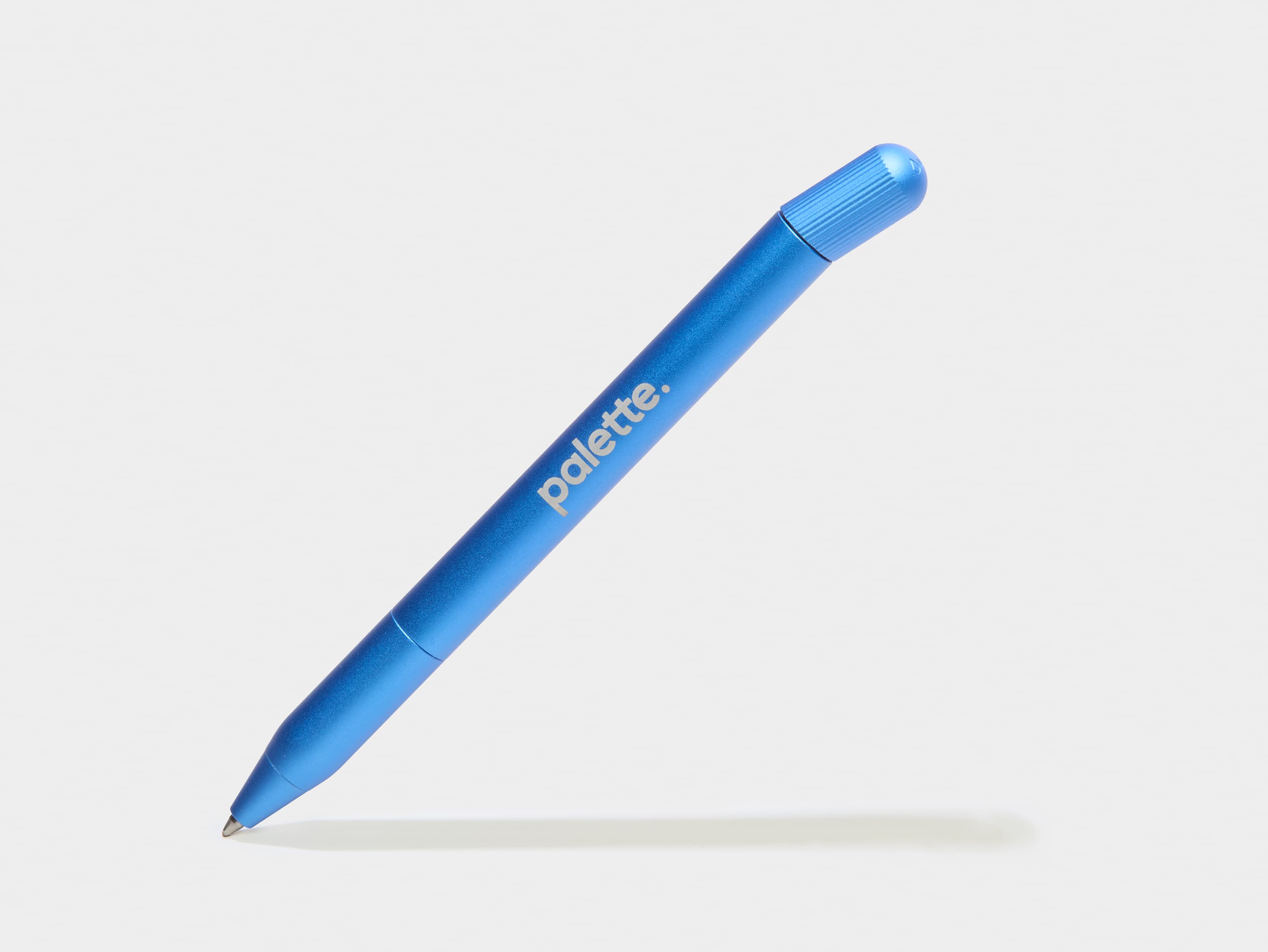 A custom blue pen with white branding.