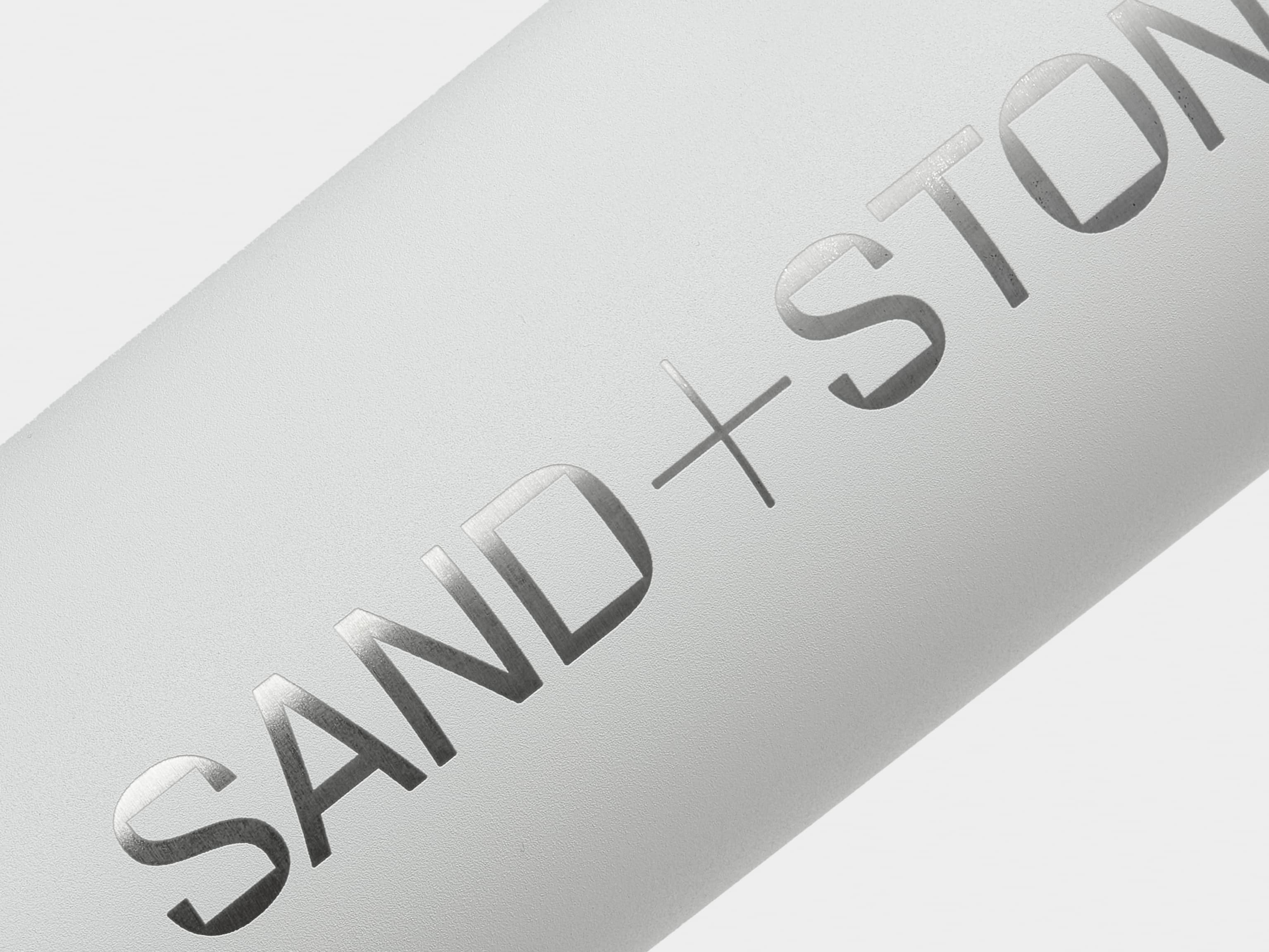 Detail image of cloud grey water bottle with custom silver branding.