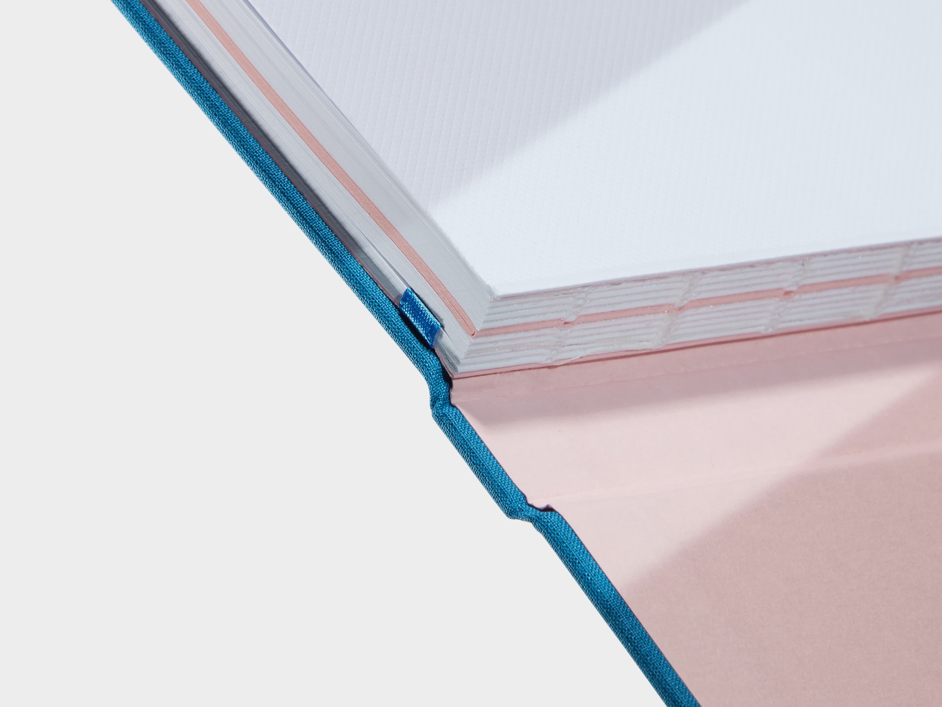 A close up of a Sky Blue Hardcover Notebook spine