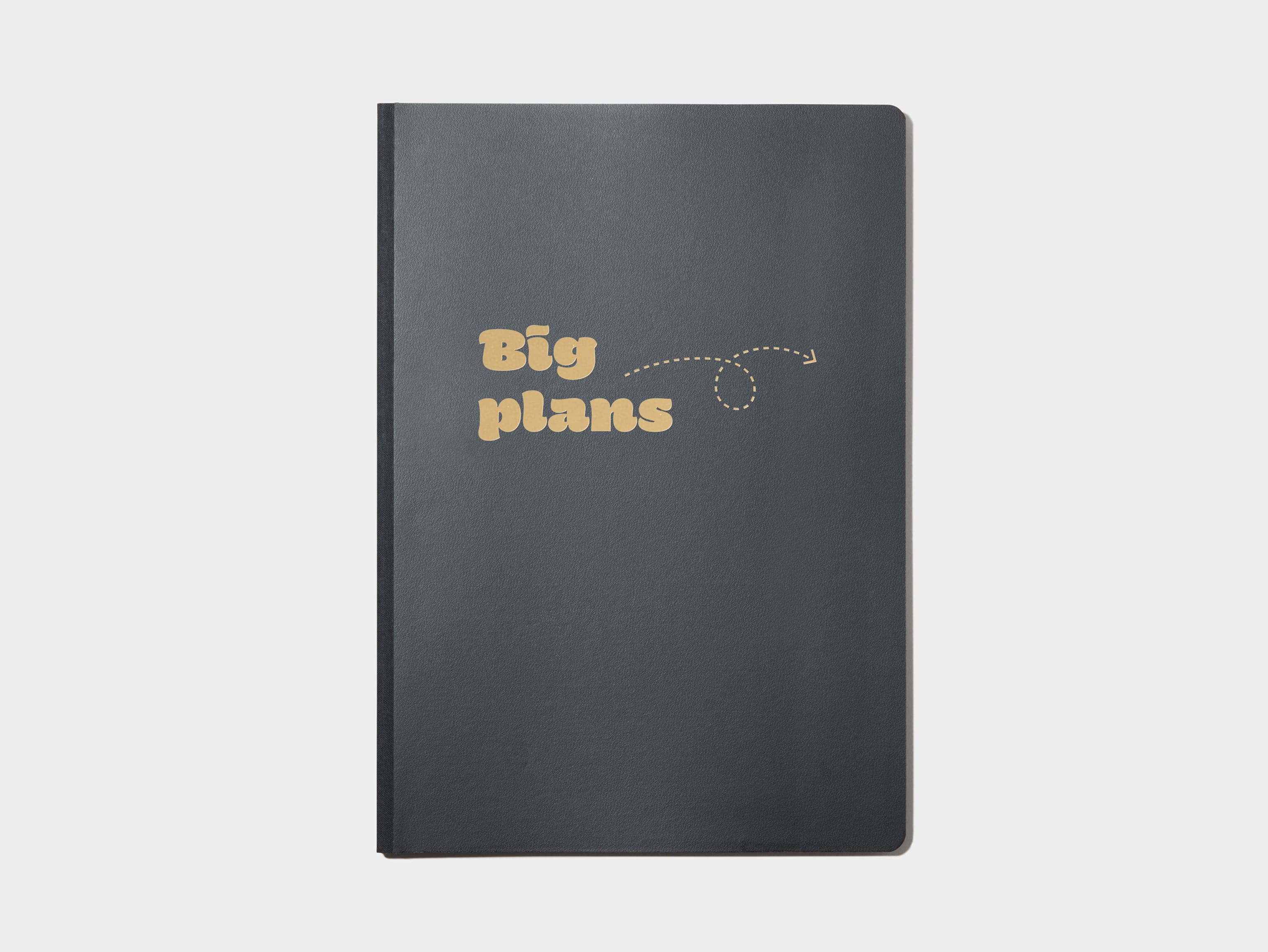 A black softcover planner with customised branding in gold foil.