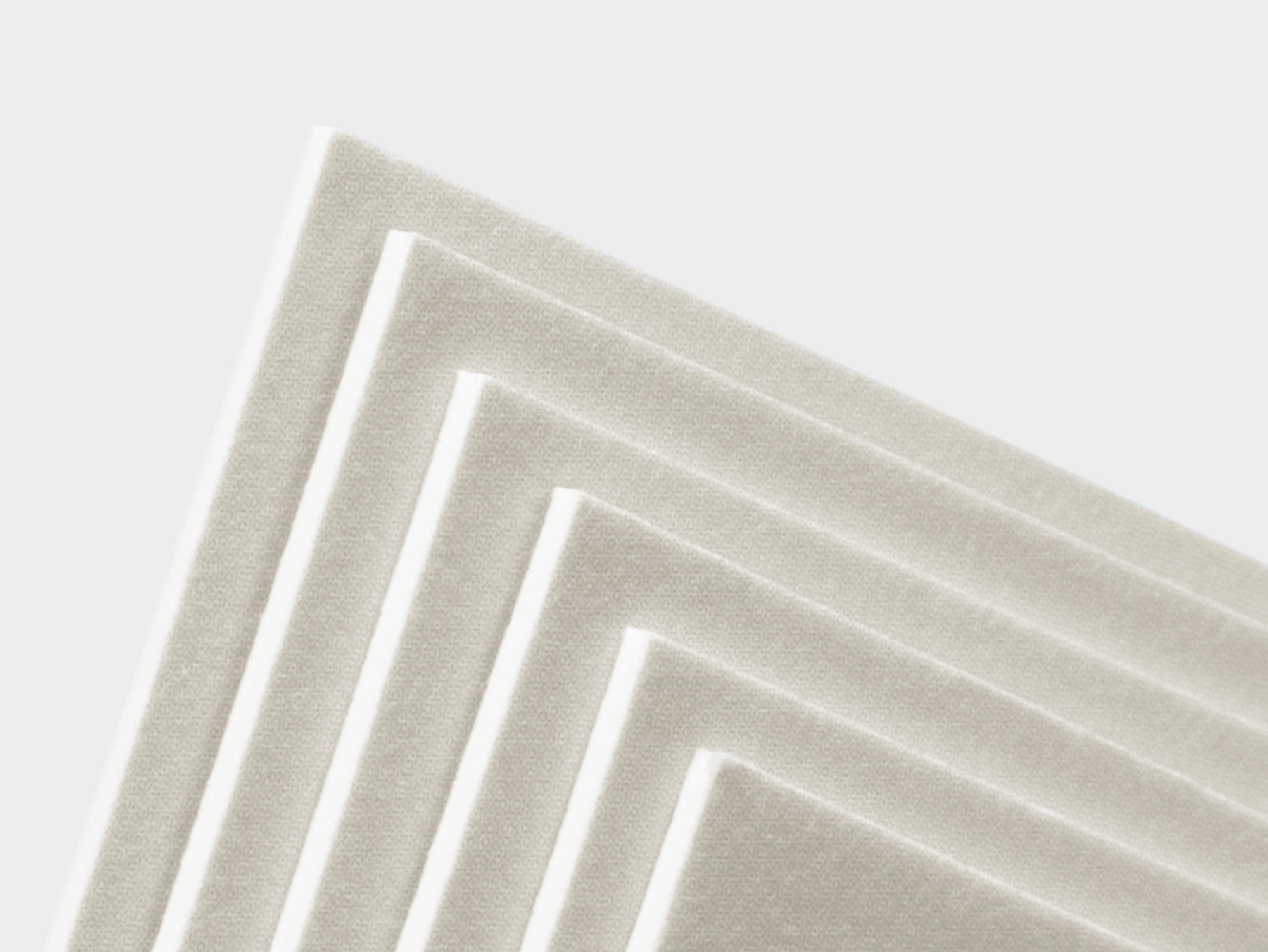 A detail image of the corners of white luxe business cards.