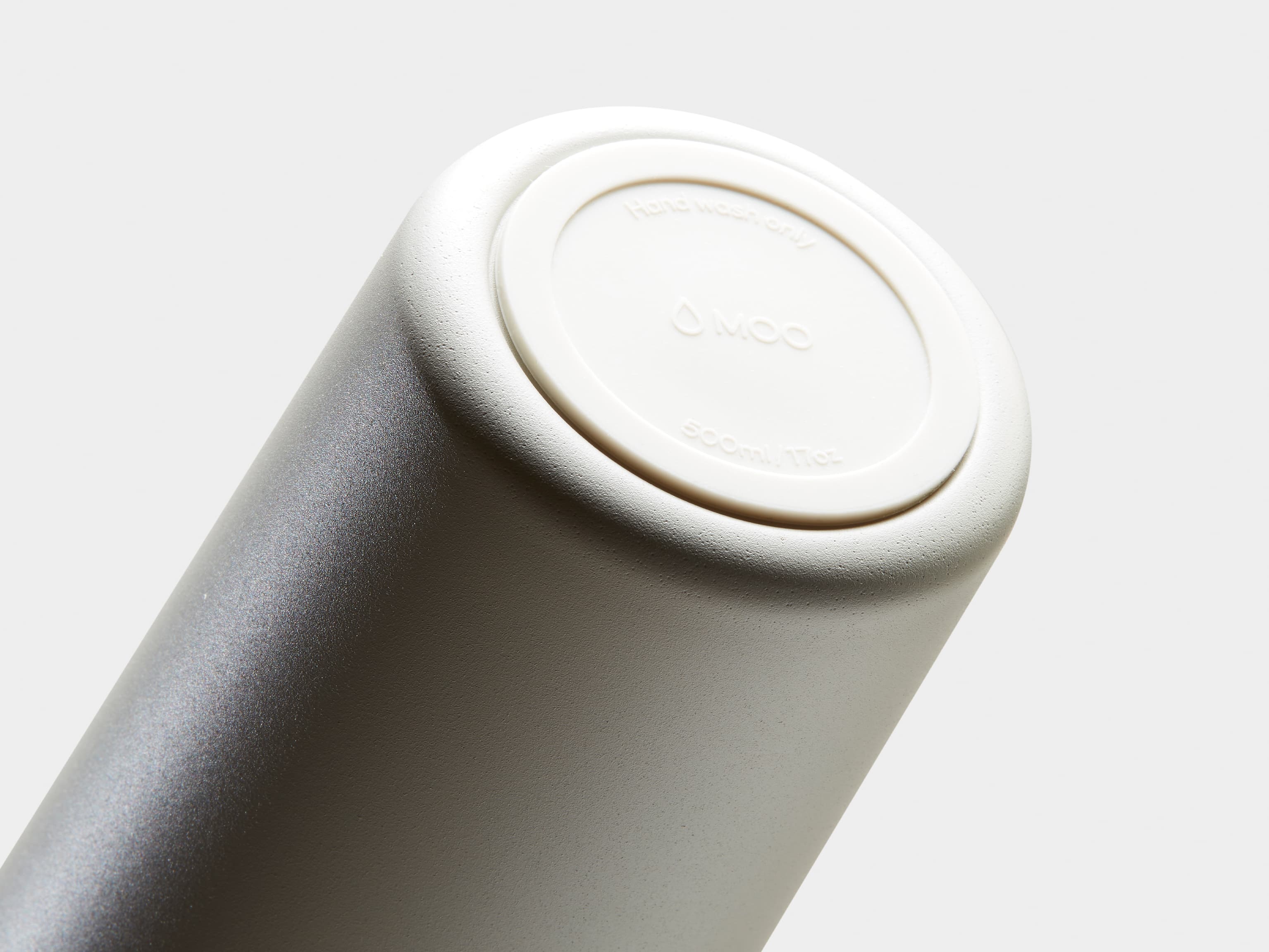 Detail image of the bottom of a cloud grey water bottle.