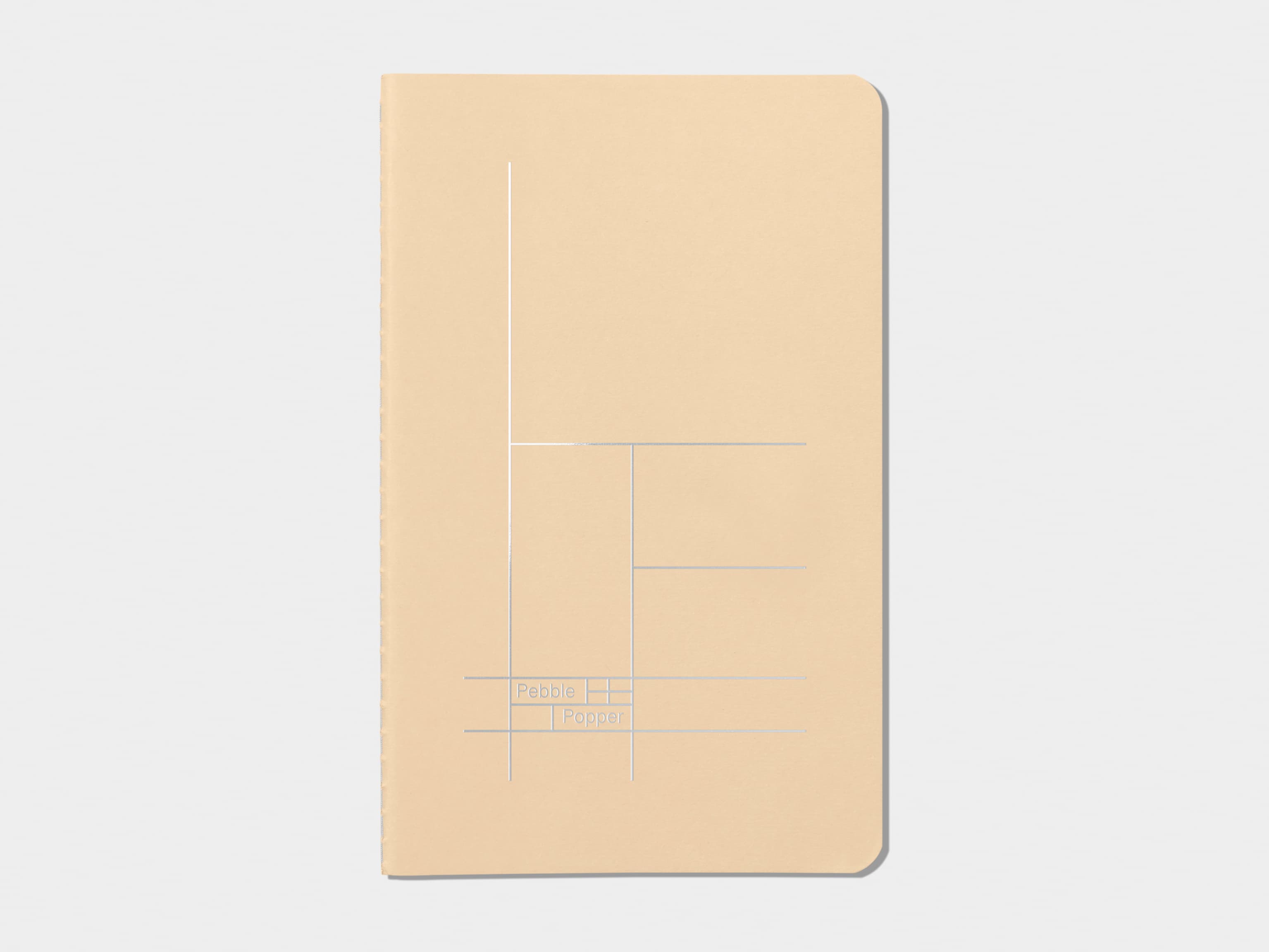 Tan soft cover journal with silver foil pattern