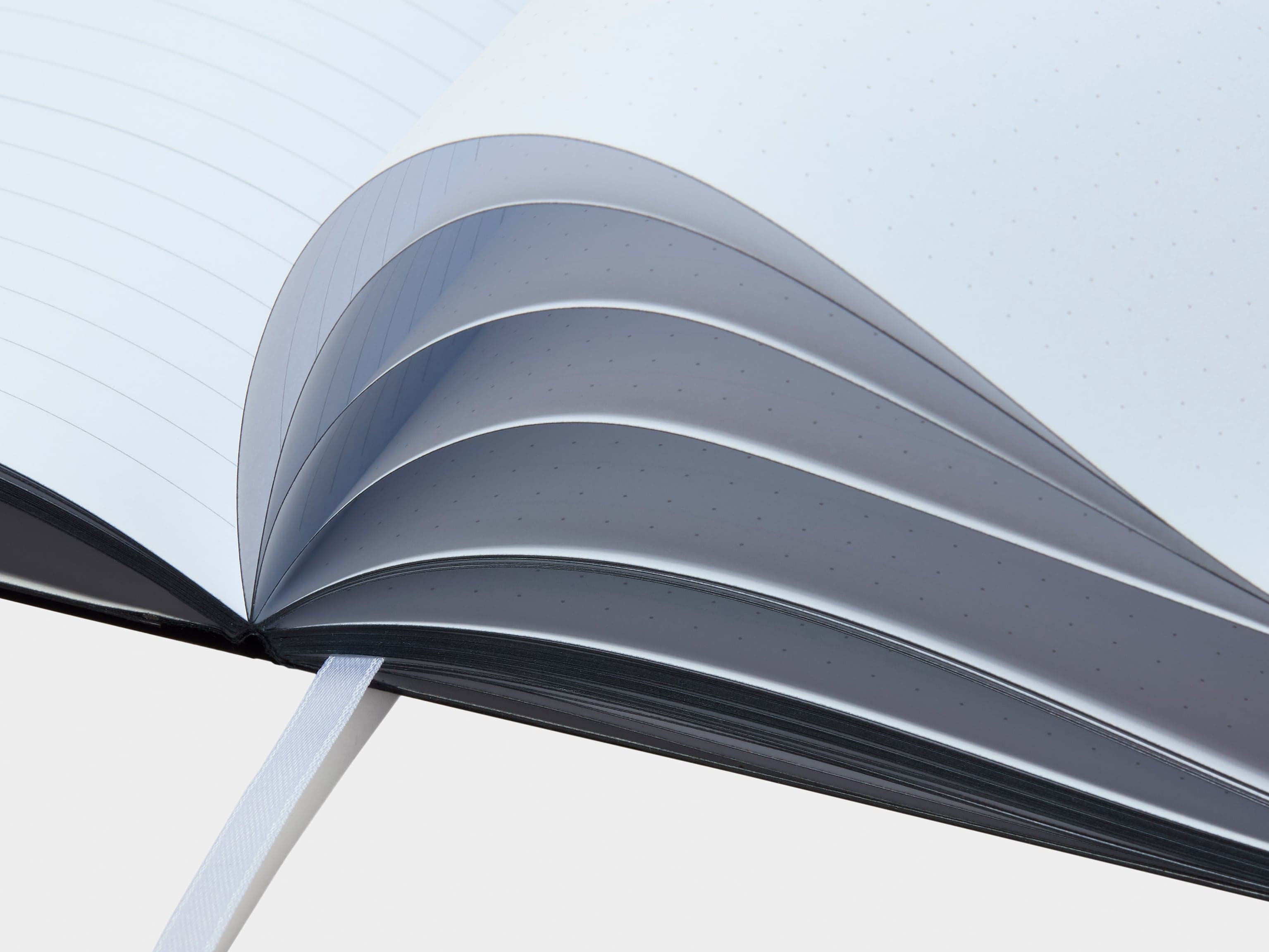 A detail image of pages in a black softcover planner.