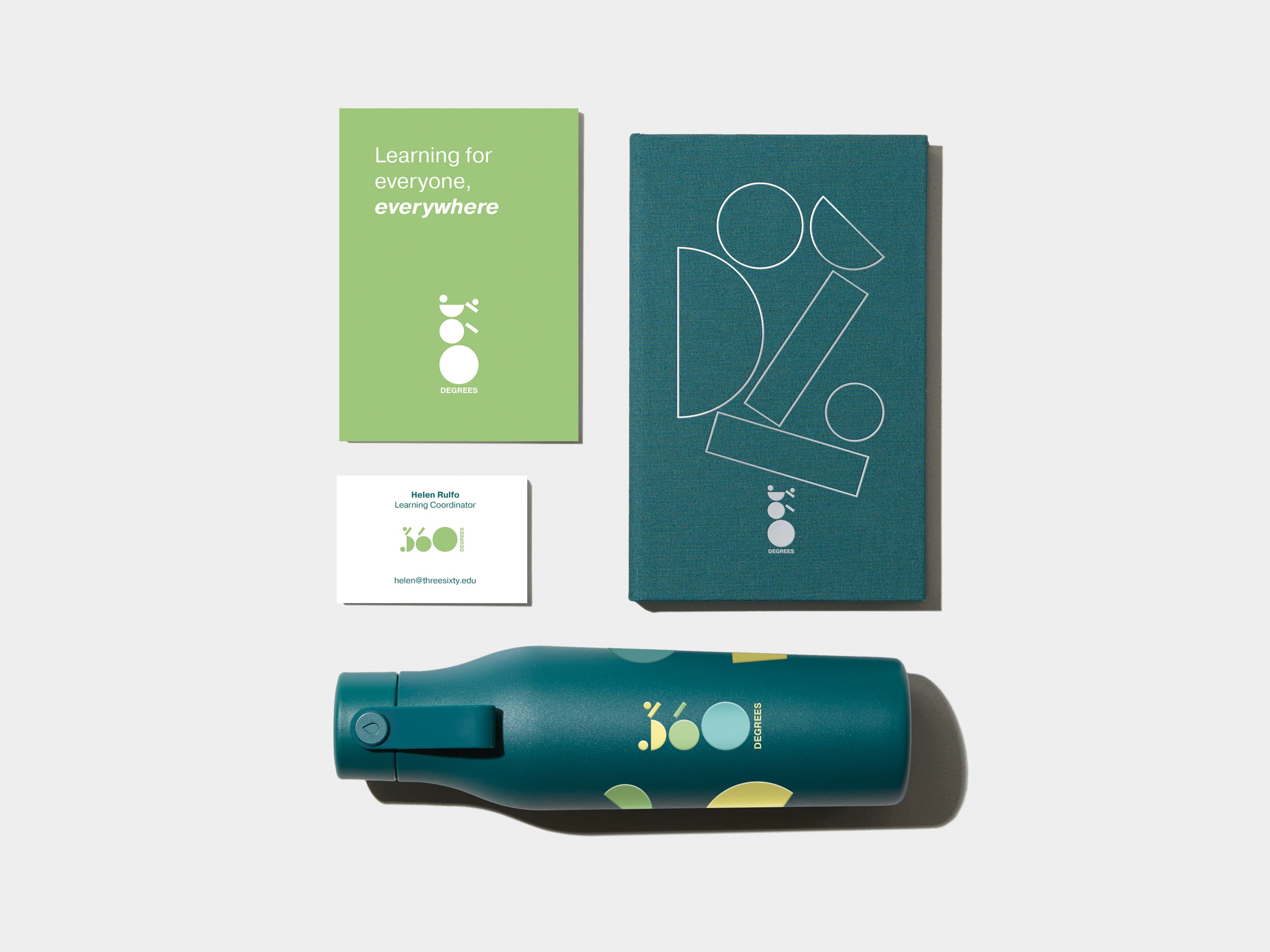 Alpine Green flyer in top left corner. Hardcover Notebook with White Foil Pattern in top right corner. A business card with green details in bottom left corner. An Alpine Green water bottle with coloured pattern in bottom right corner.  