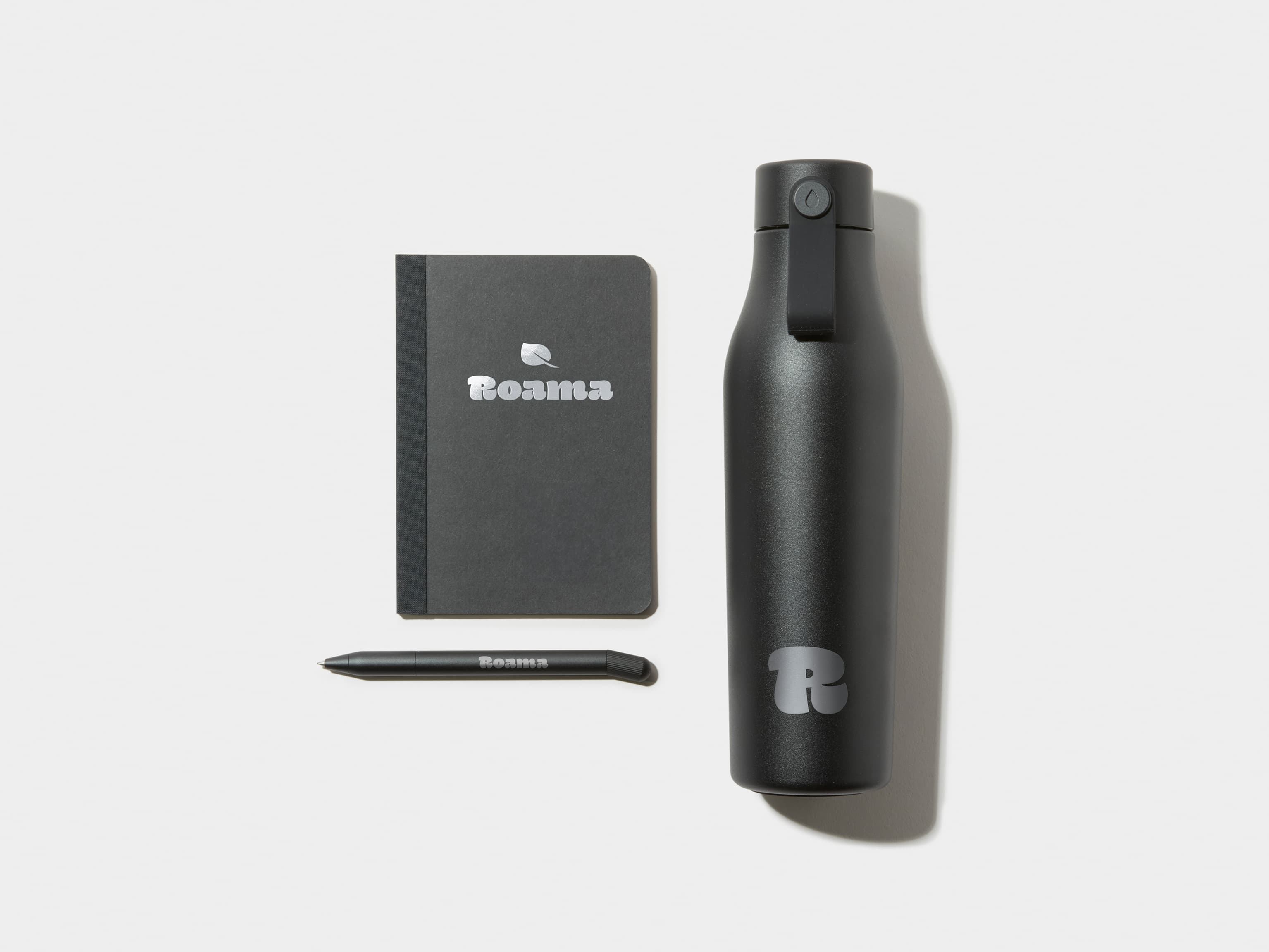 Black Tape Bound Notebook, Black Water Bottle and Black Pen