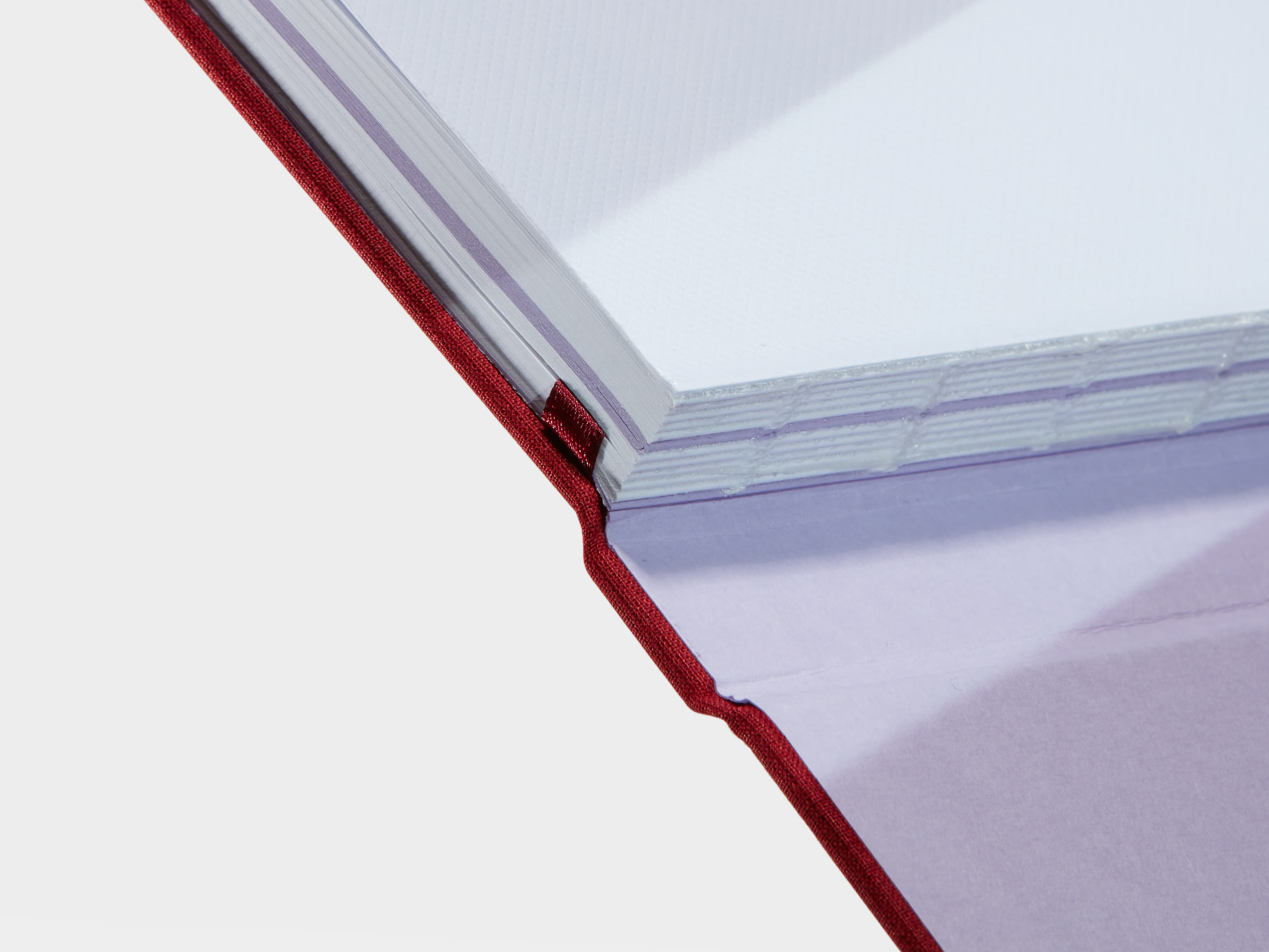 A close up of a Wine Red Hardcover Notebook spine