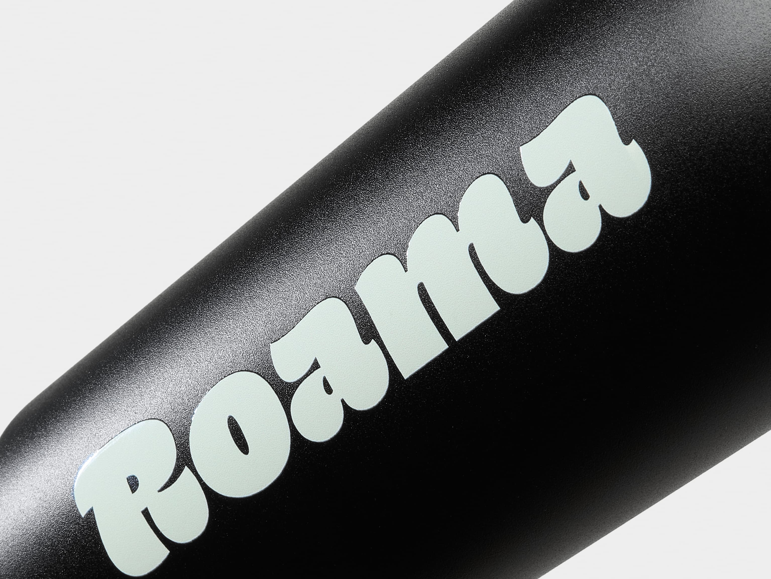 Detail image of a black water bottle with custom branding.