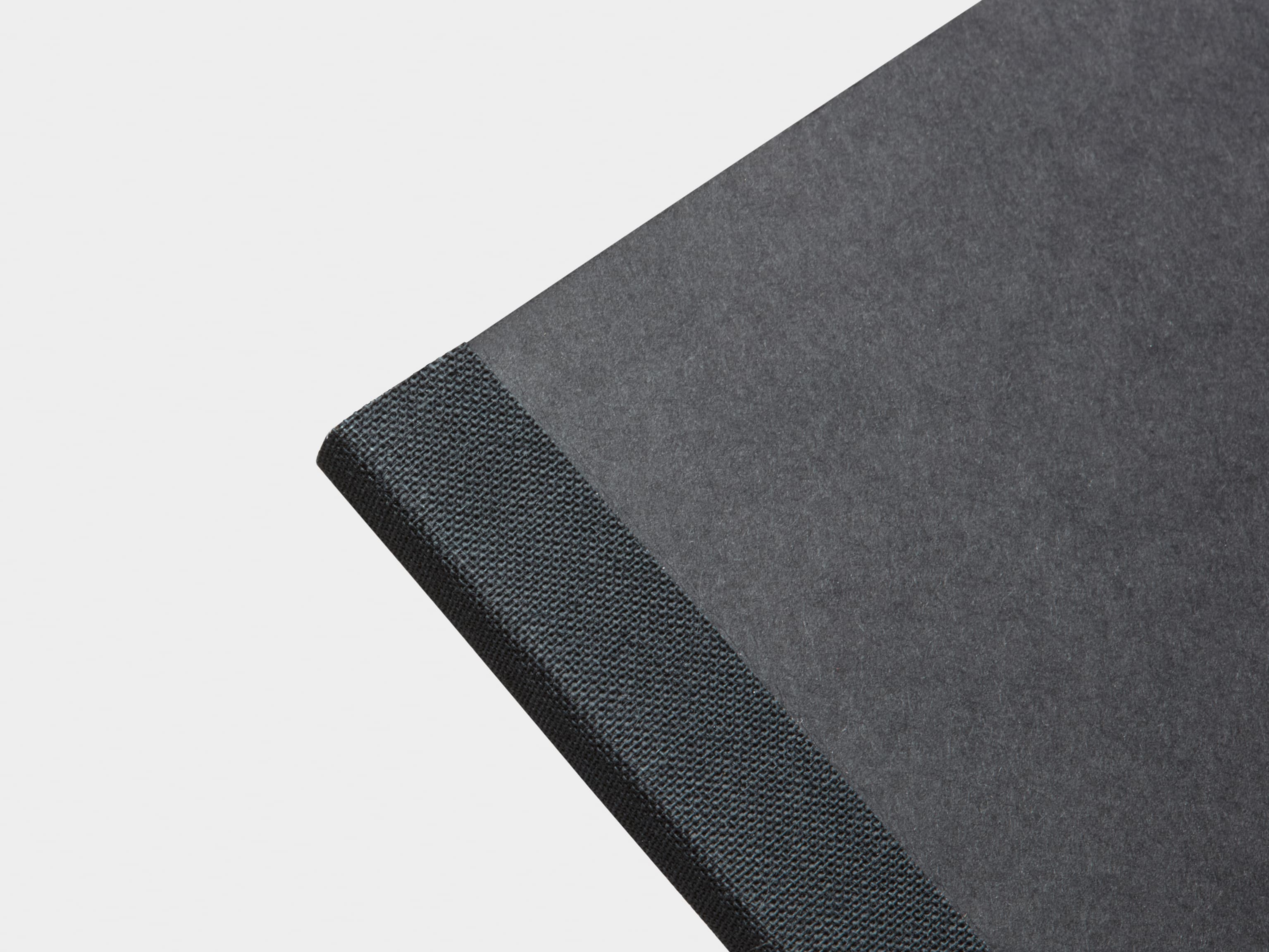 Close-Up of Black Tape Bound Notebook in A4