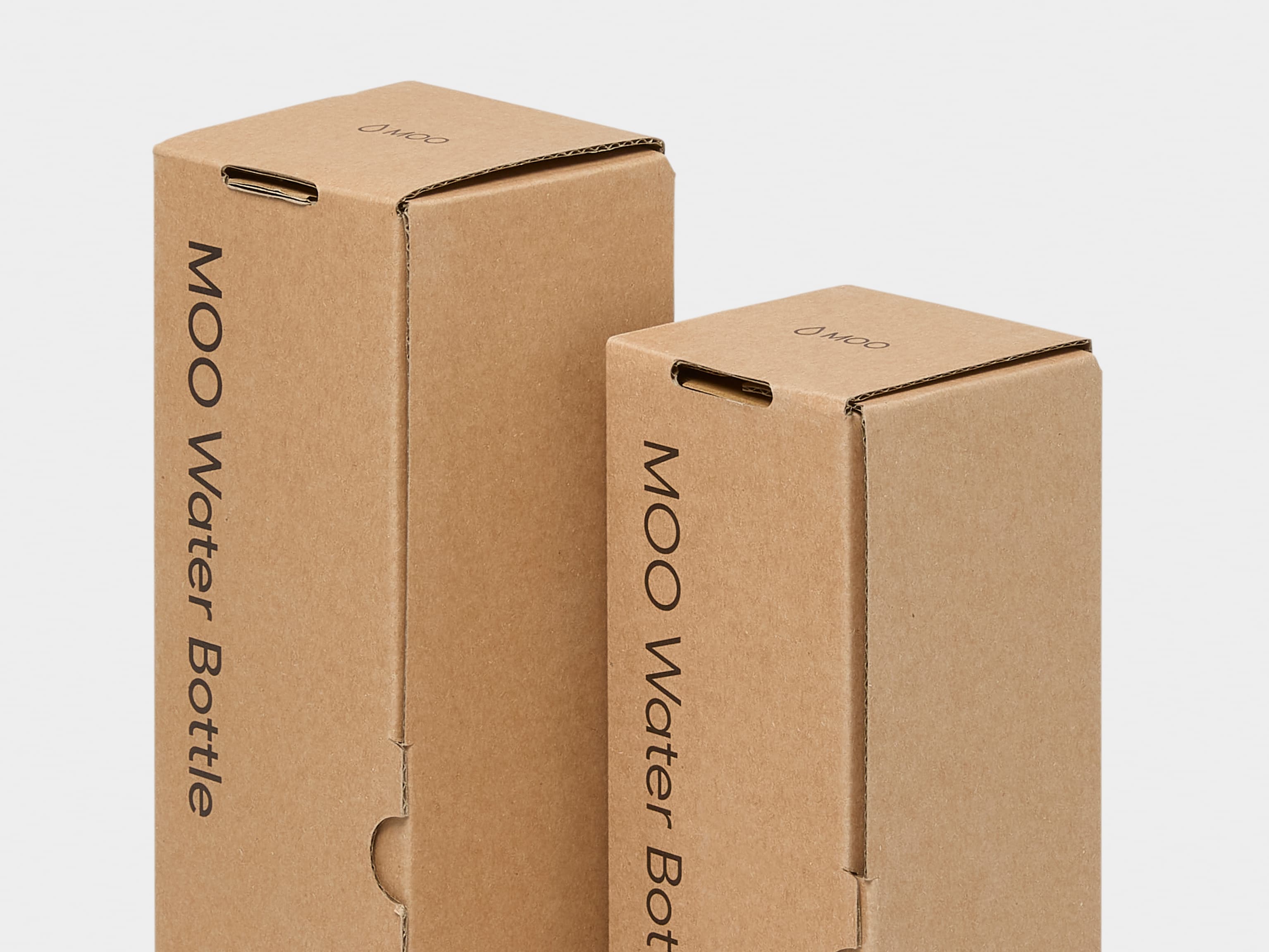 A close up image of cardboard packaging for the MOO water bottle.