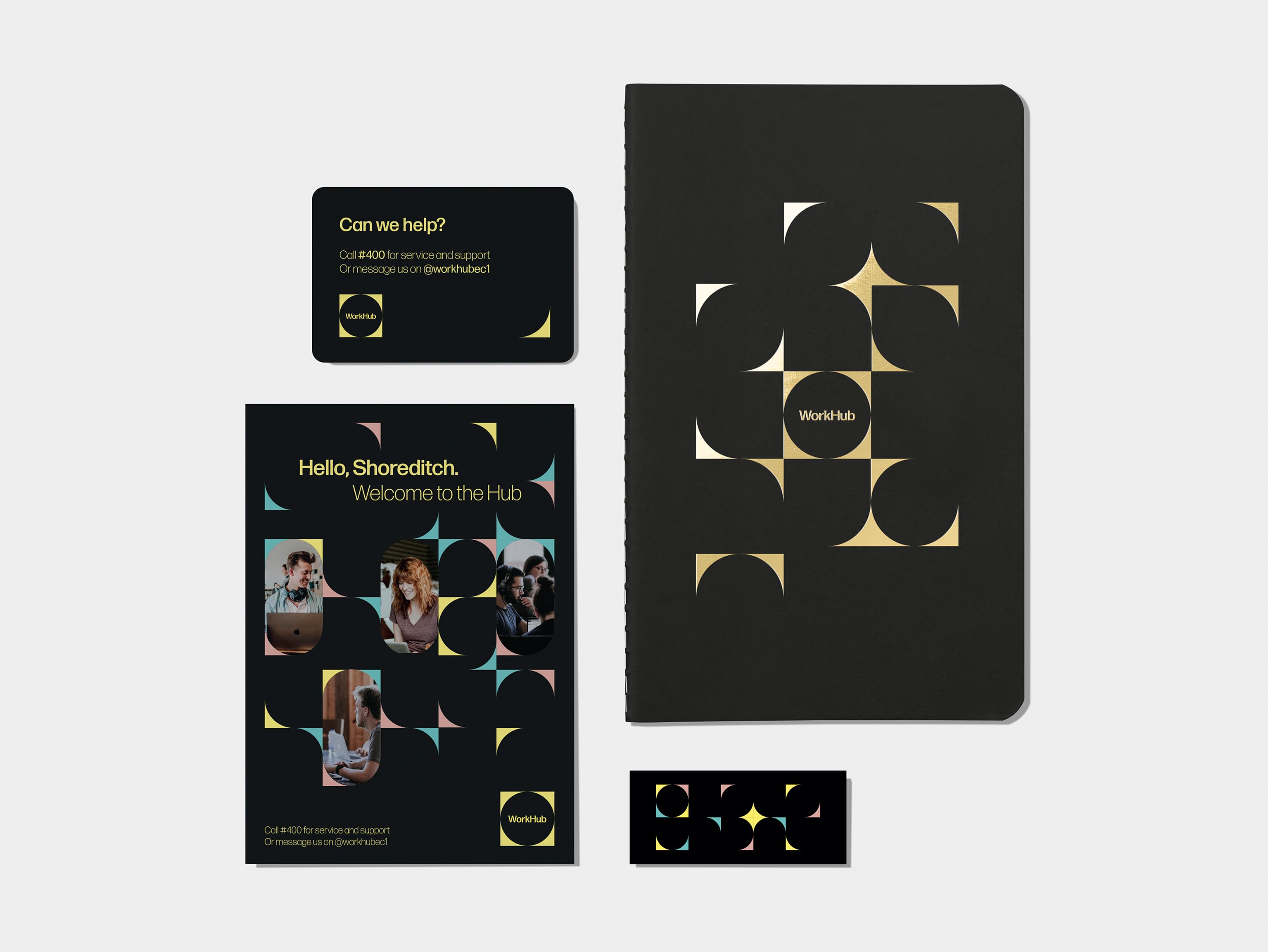 A flyer on the top left corner. Jet Black  soft cover journal with silver foil pattern in top right corner. A business card on bottom left corner. A mini card on bottom right corner.