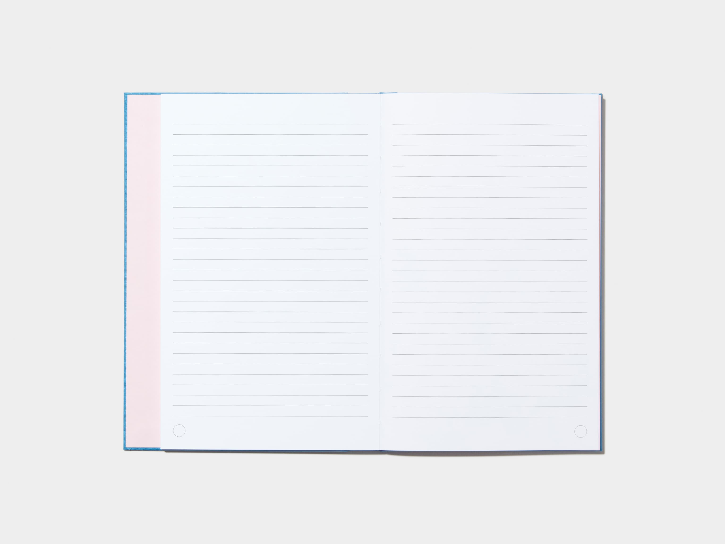 An opened Sky BlueHardcover Notebook with lined pages 