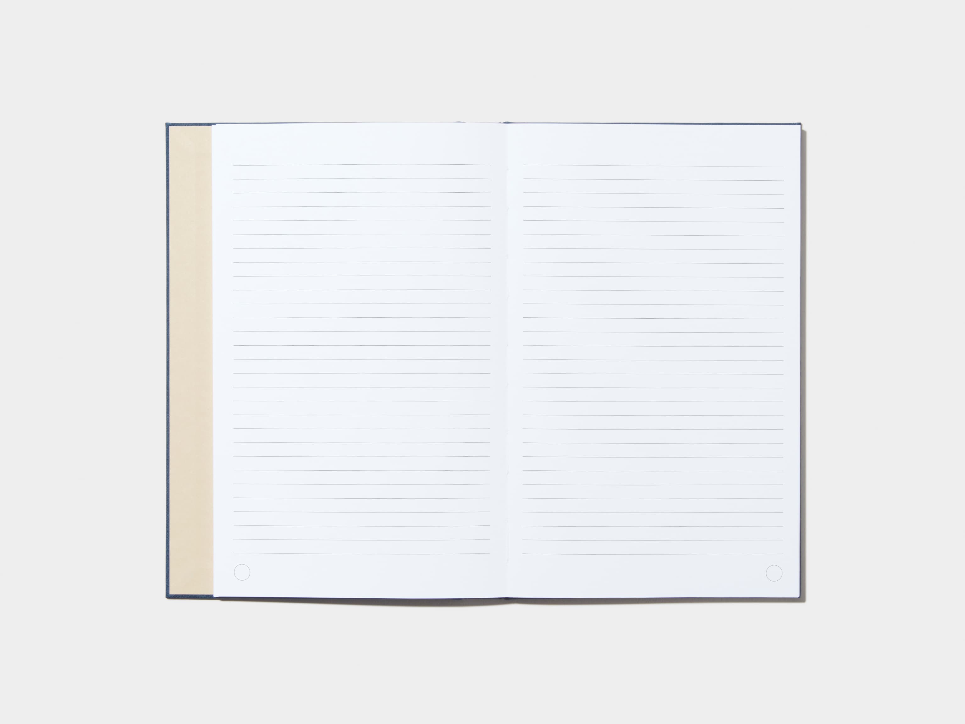 An opened Midnight Blue Hardcover Notebook with lined pages 