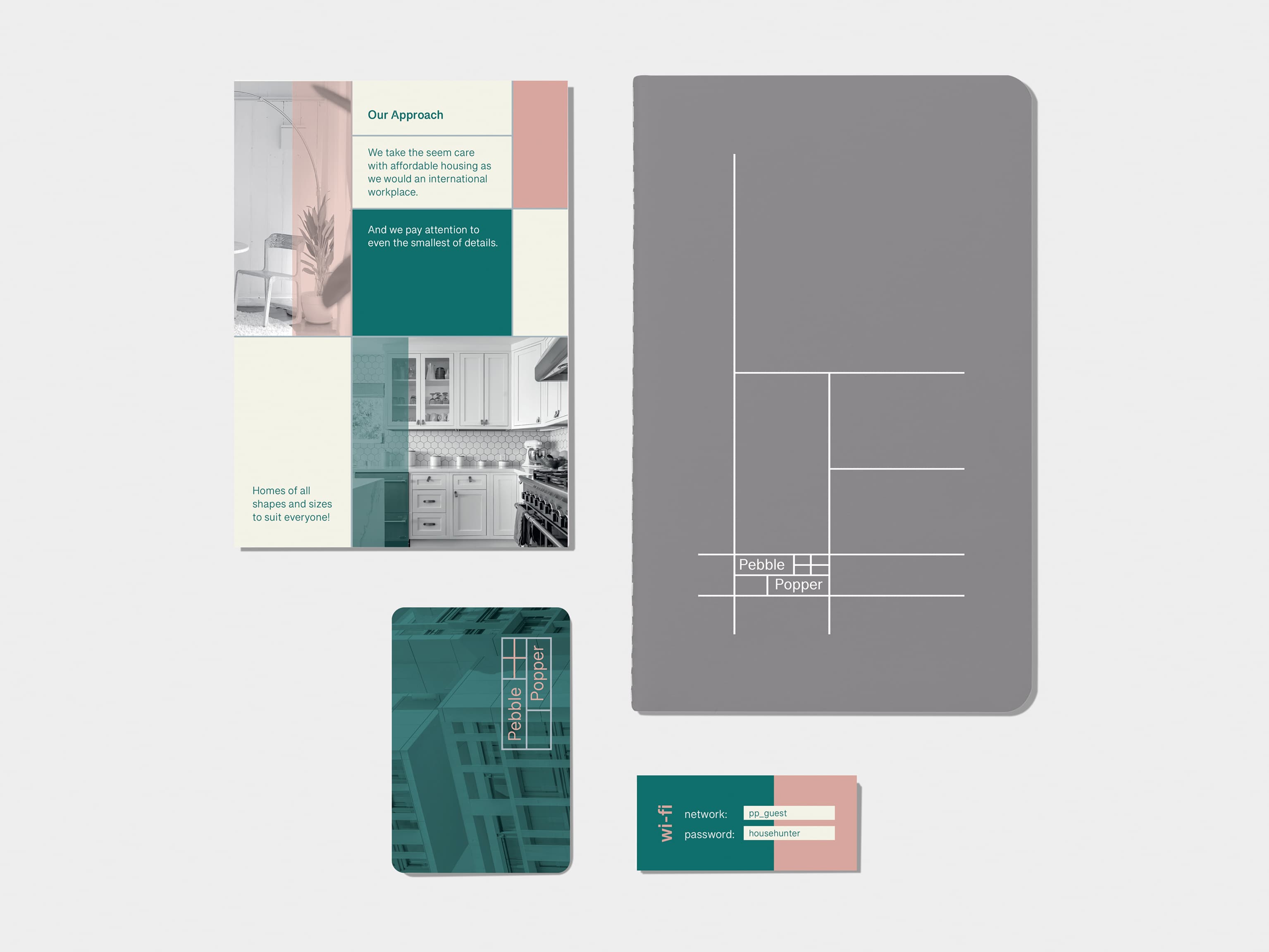 A flyer on the top left corner. Charcoal grey soft cover journal with silver foil pattern in top right corner. A business card on bottom left corner. A mini card on bottom right corner.