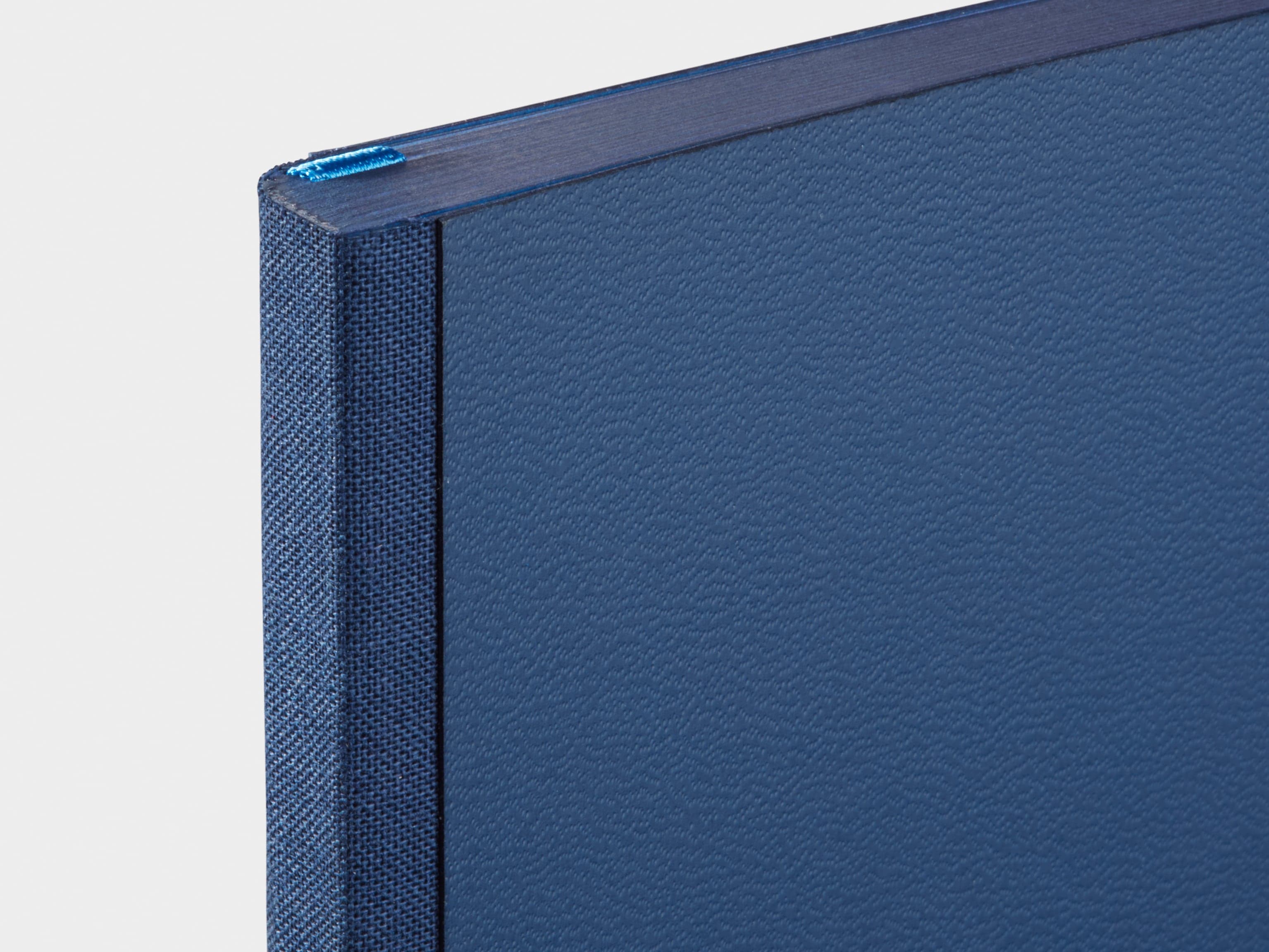 Detail image of the spine of a blue planner.