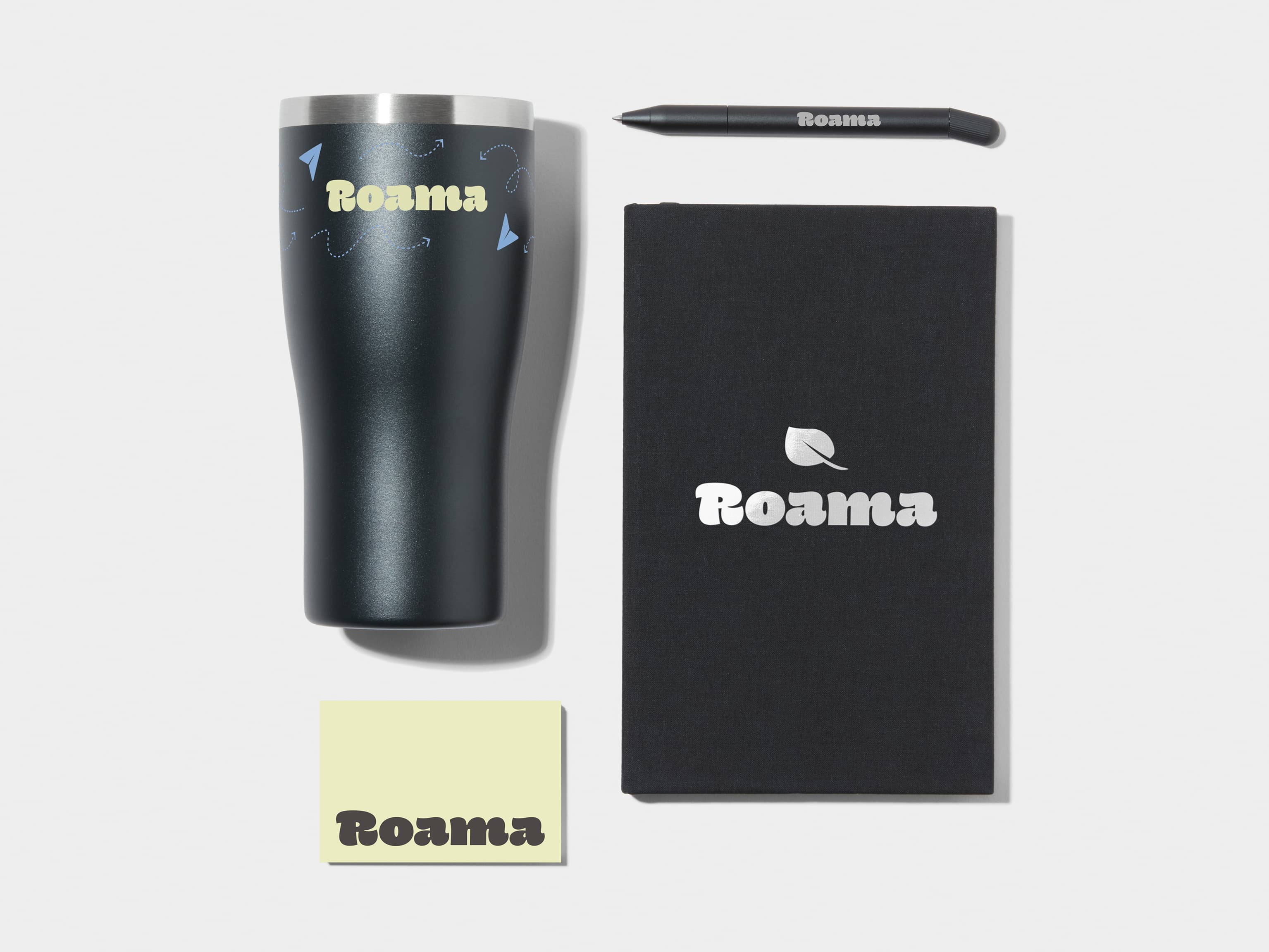 Insulated Tumbler in Jet Black with 360 wrap printing customisation next to a Jet Black Hard Cover Notebook, MOO Twist Pen and Business Card with custom branding