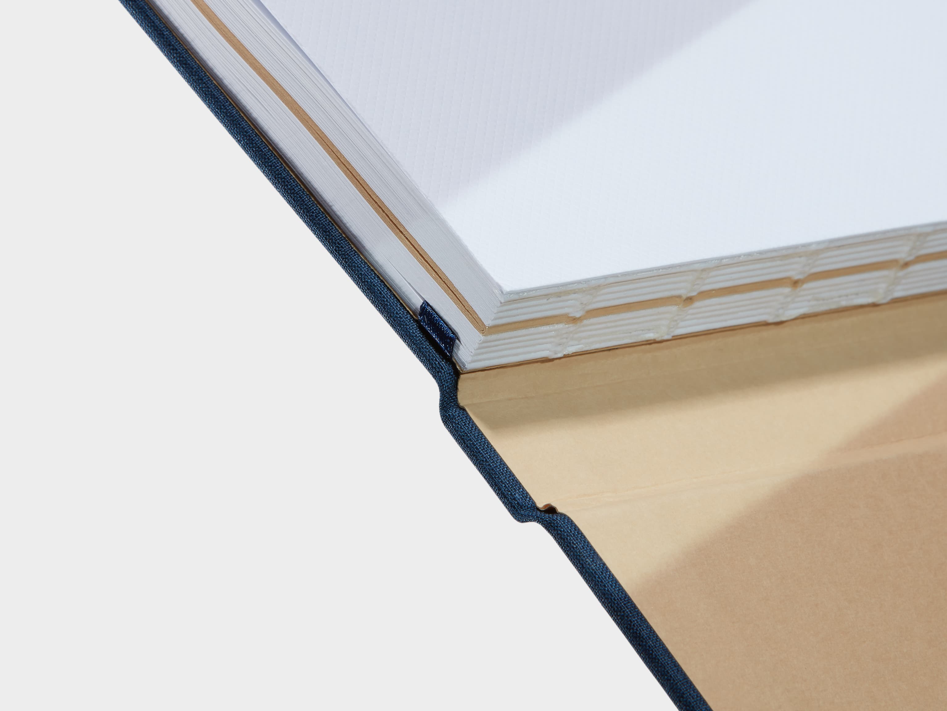 A close up of a Midnight Blue Hardcover Notebook spine