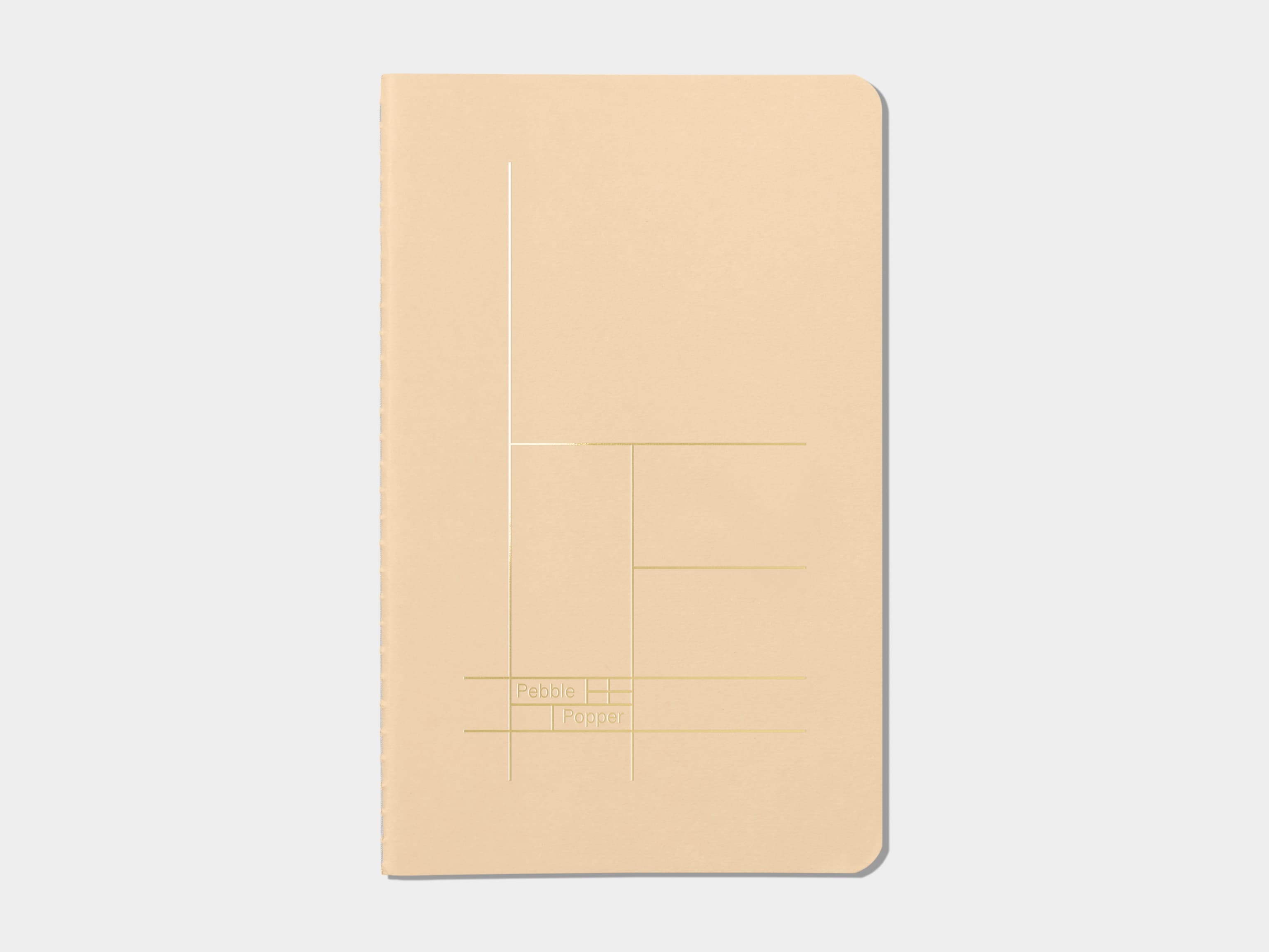 Tan soft cover journal with gold foil pattern