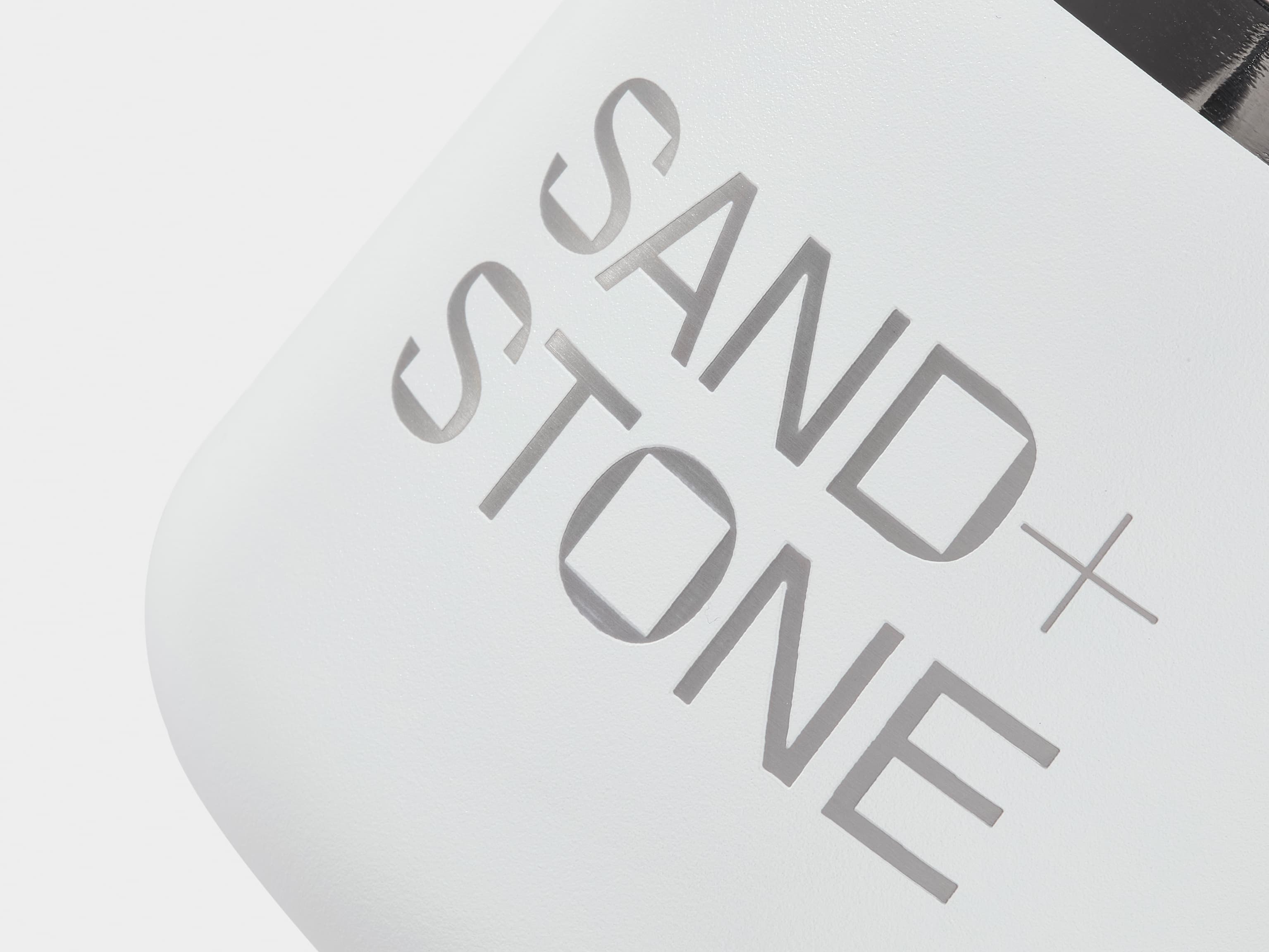 A close up image of customised branding on a cloudy grey insulated mug.