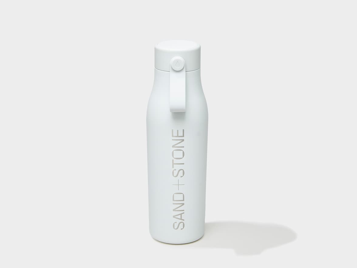 A cloudy grey MOO water bottle with engraving customization.
