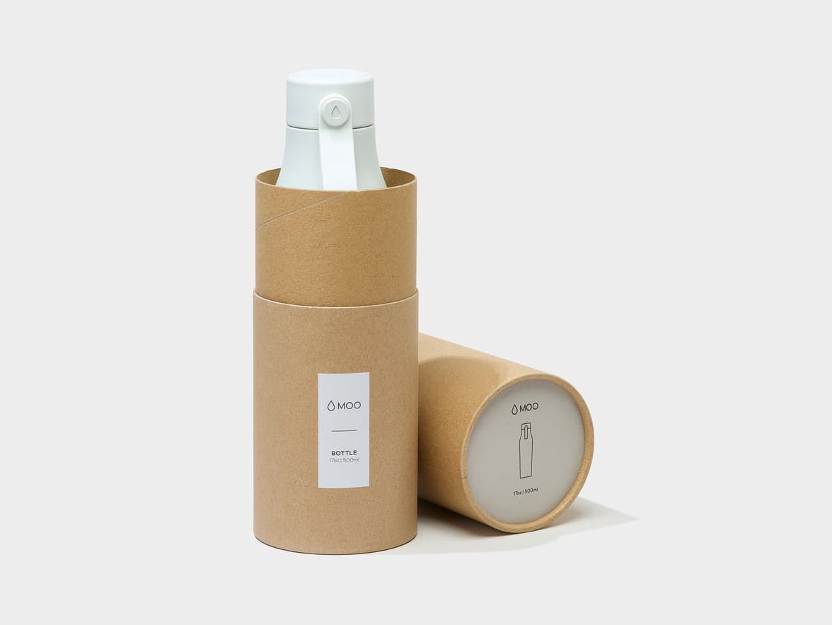 A cloud grey water bottle in MOO packaging.