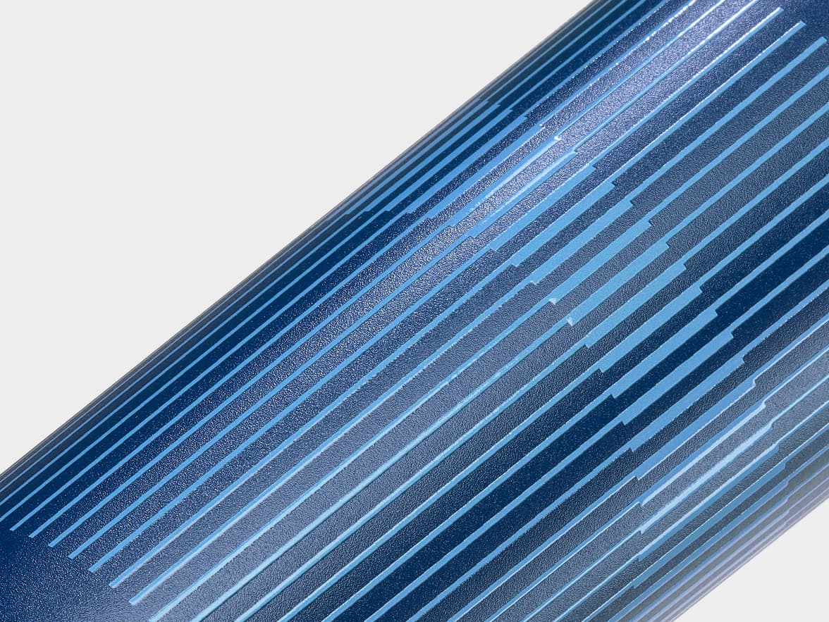 A detail image of a blue water bottle with custom blue branding.