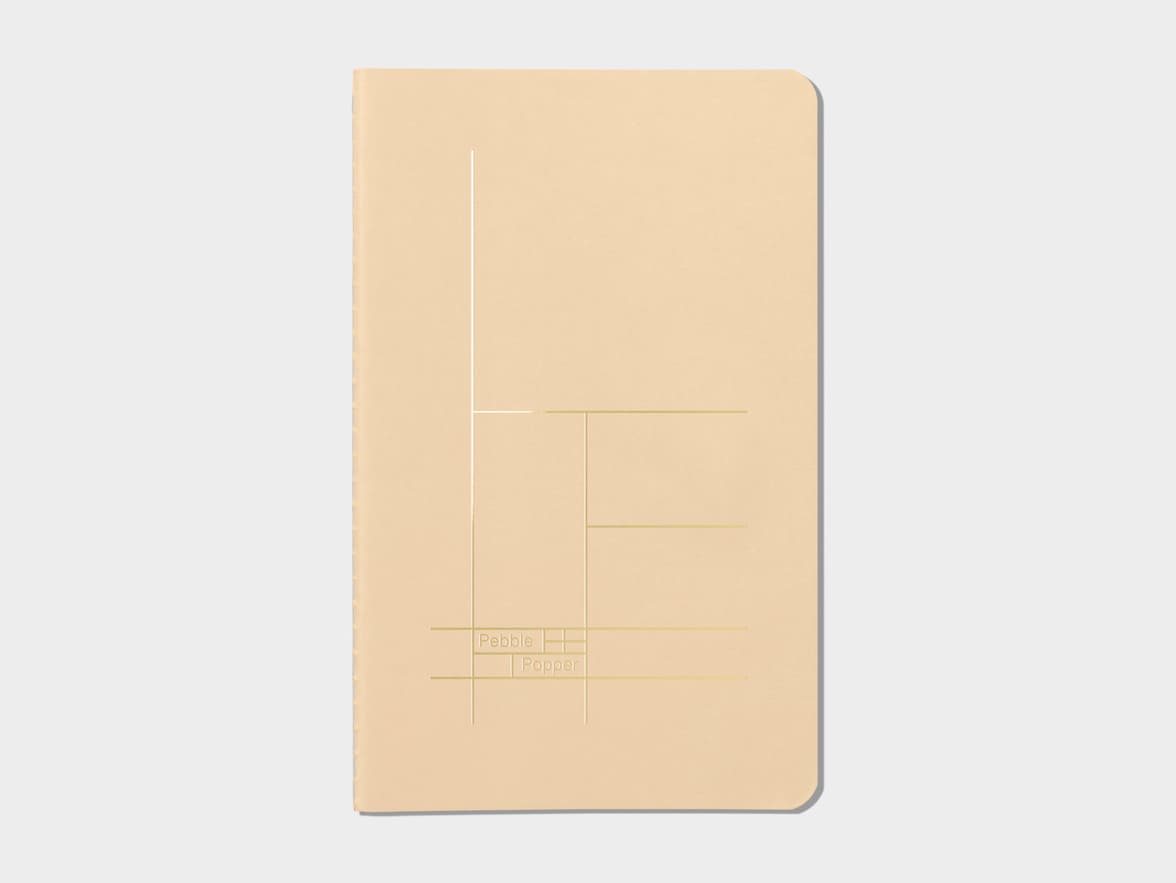Tan soft cover journal with gold foil pattern