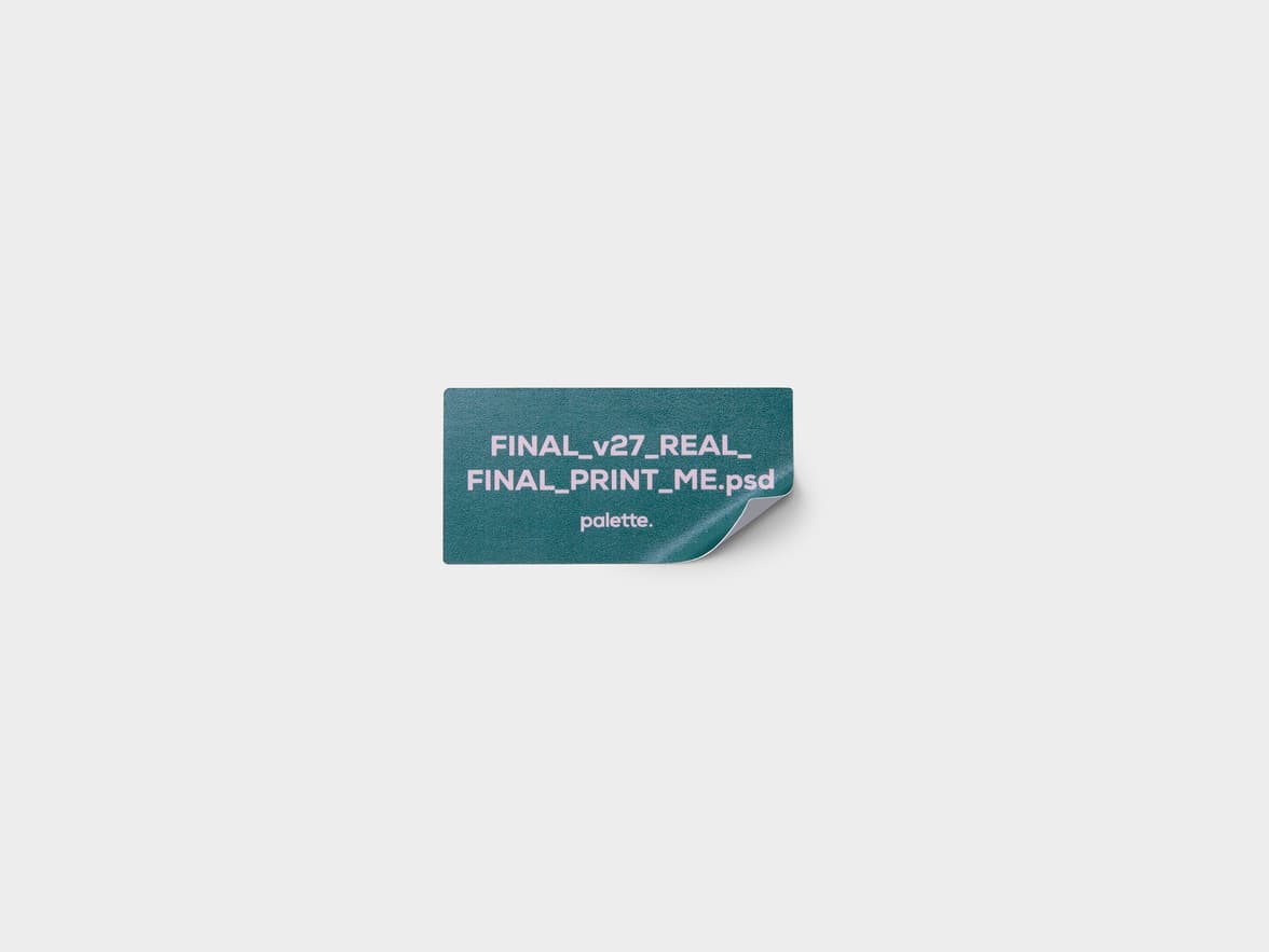 A coated rectangular sticker with customization in green and purple printed on it.