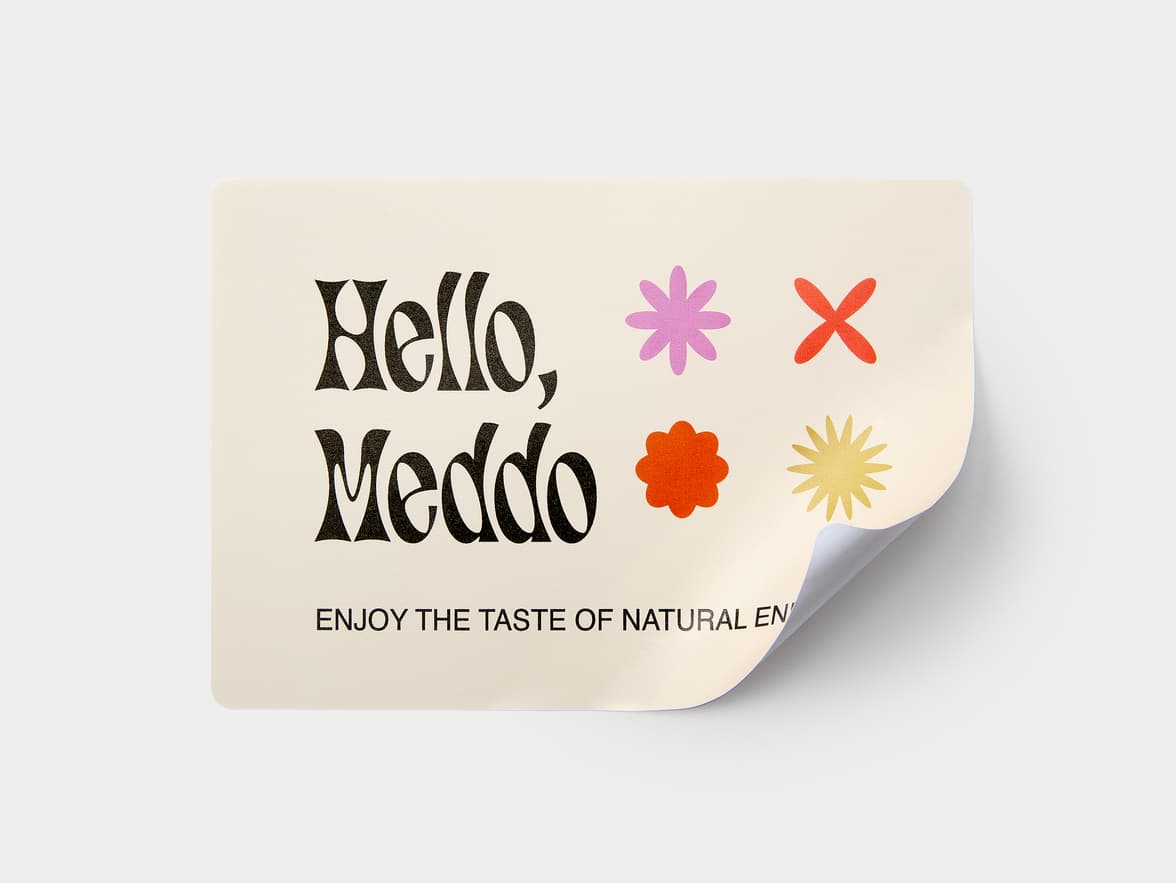 A customized coated rectangular sticker with the bottom right corner peeling up.