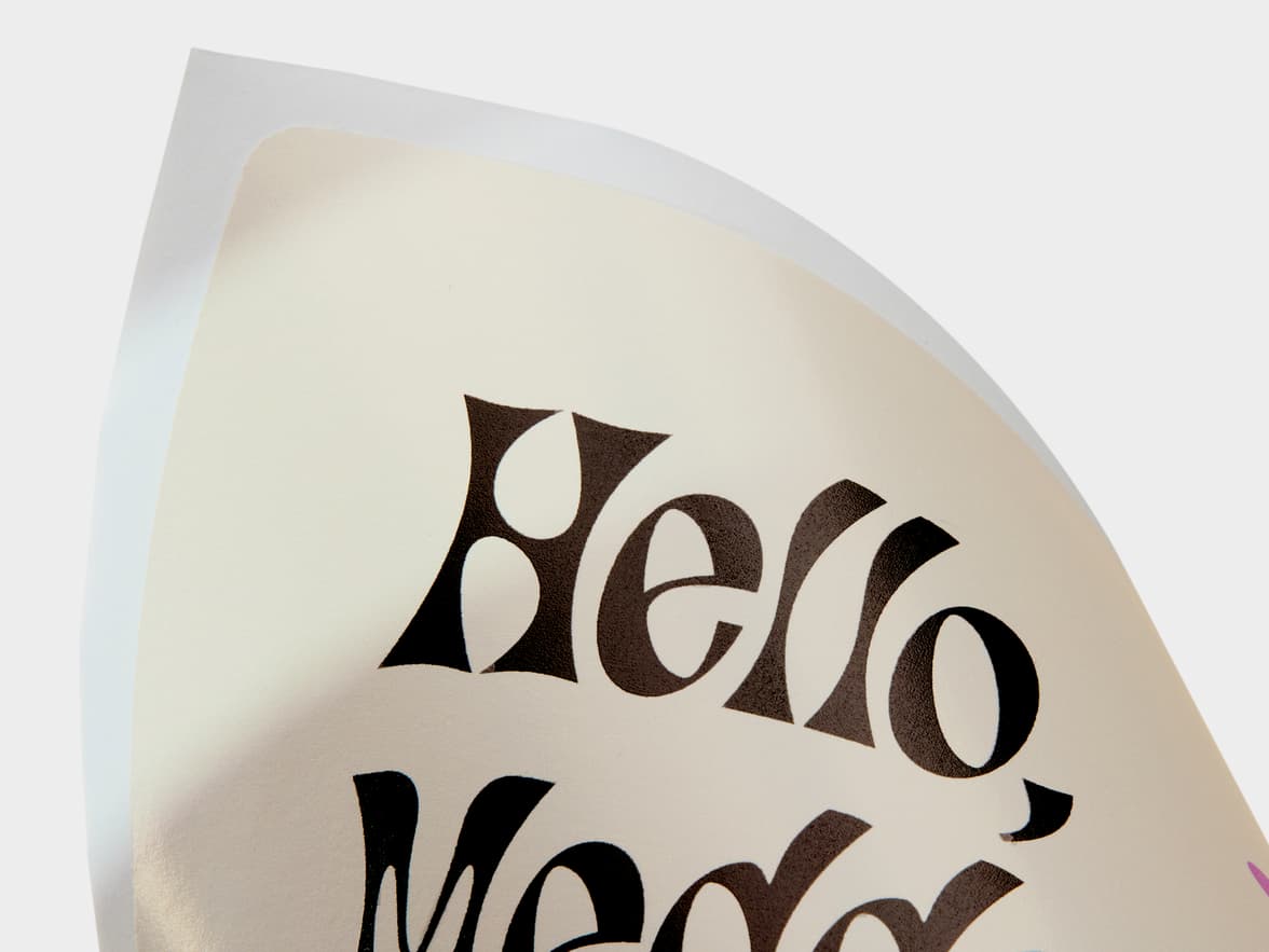 A close up image of a customized coated rectangular sticker.