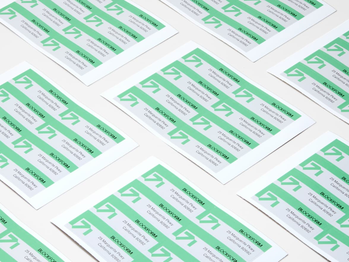 A collection of customized rectangular coated stickers on sheets.